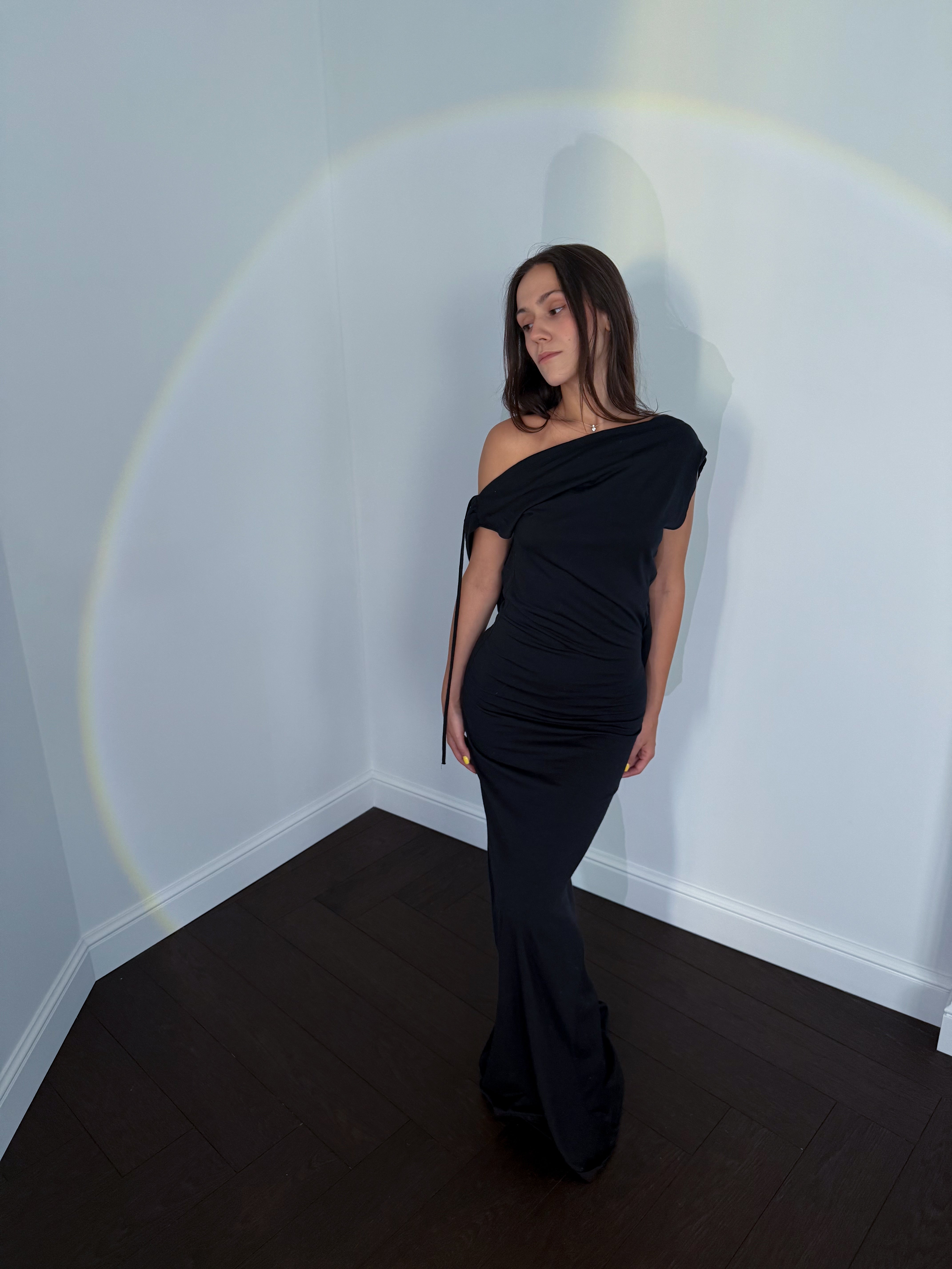 A model wearing the axis silk jersey dress in a white background. 100% made from deadstock.