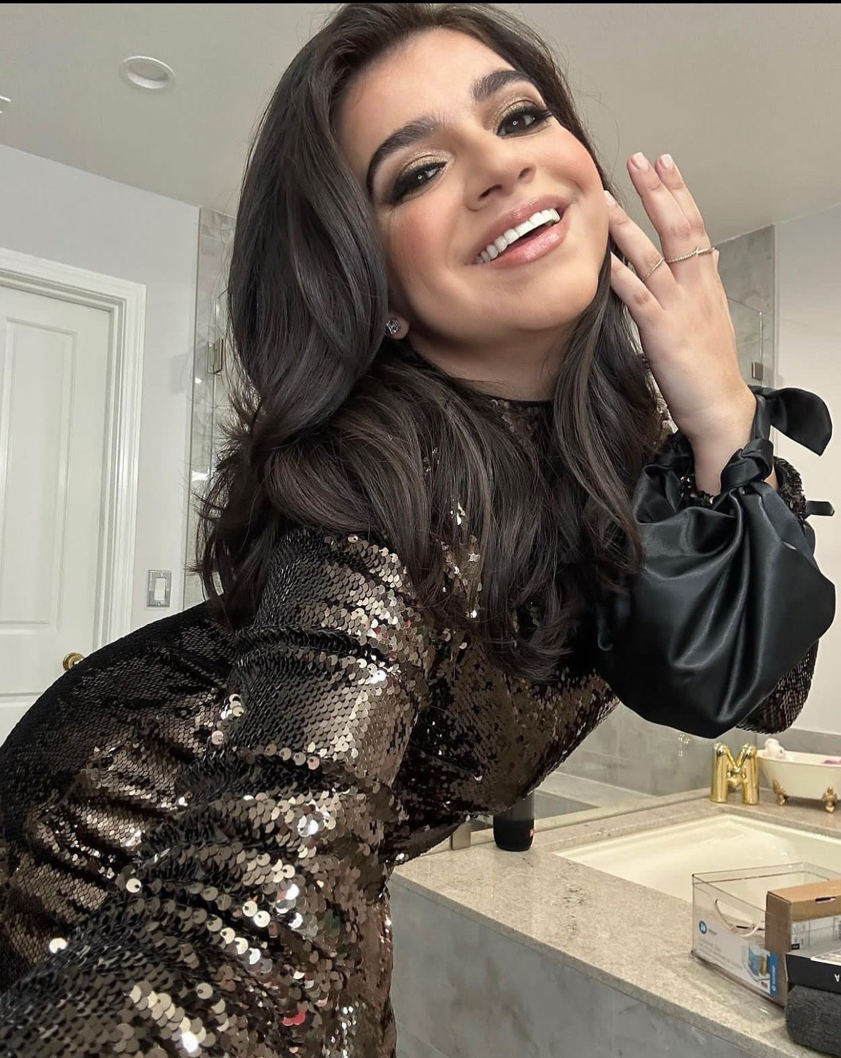 A model wearing the black silk knot bag. Deadstock silky satin fabric sourced in Los Angeles.