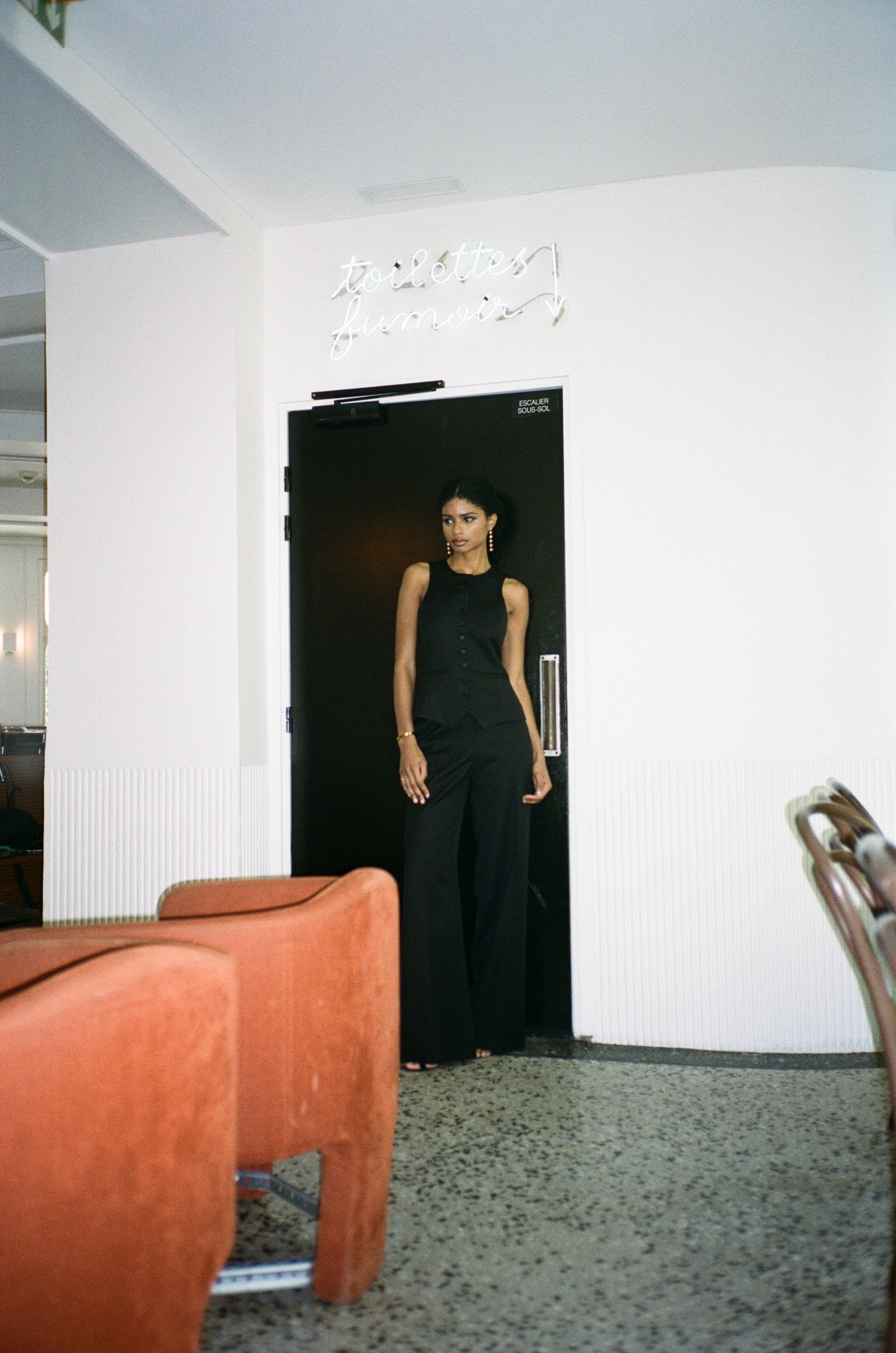 A model wearing the bianca wool and satin smoking pants in an aesthetically background. 100% upcycled wool and silk mix.