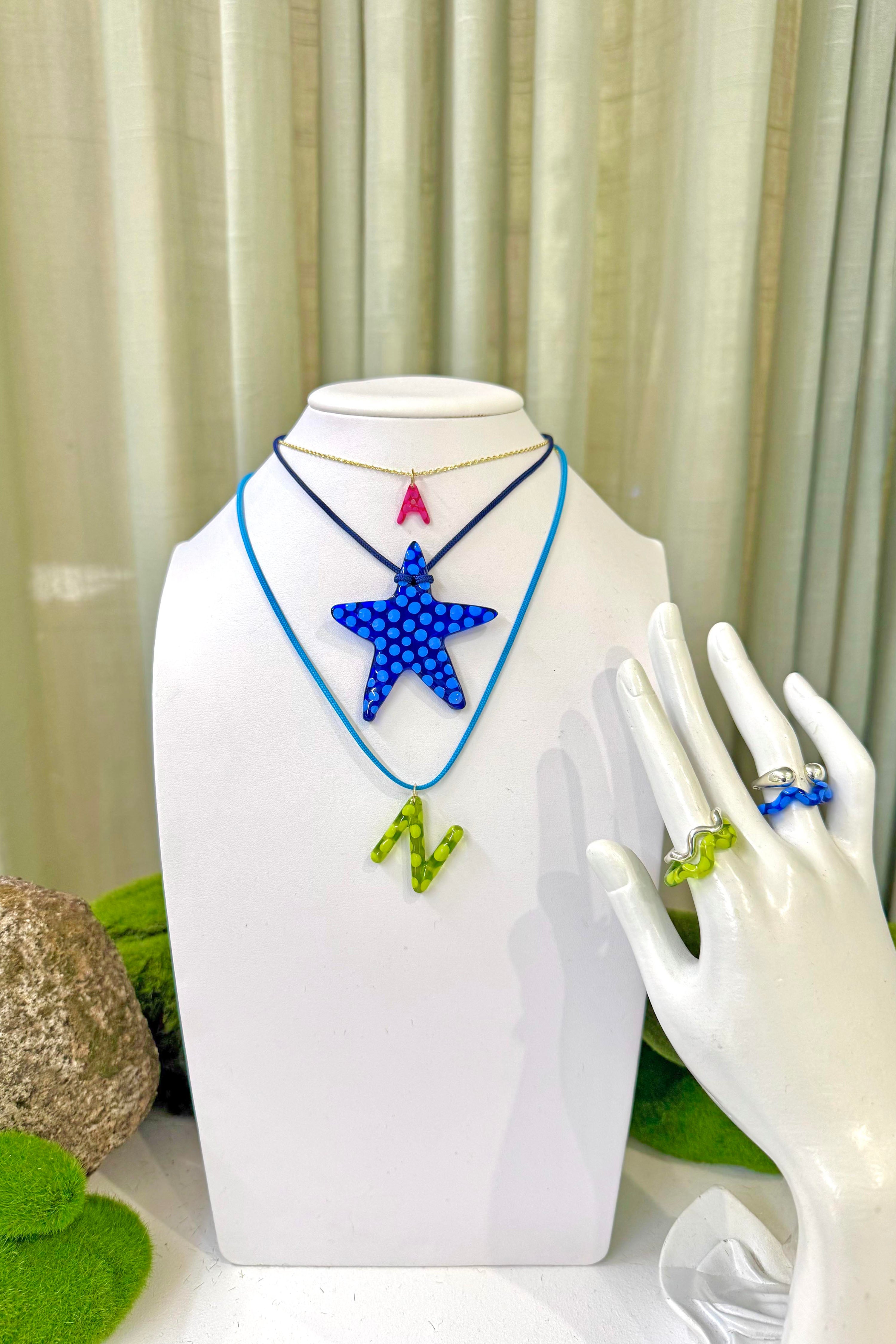 The blueberry charm on display. Charm are 3D printed and hand finished. Made in New York. 