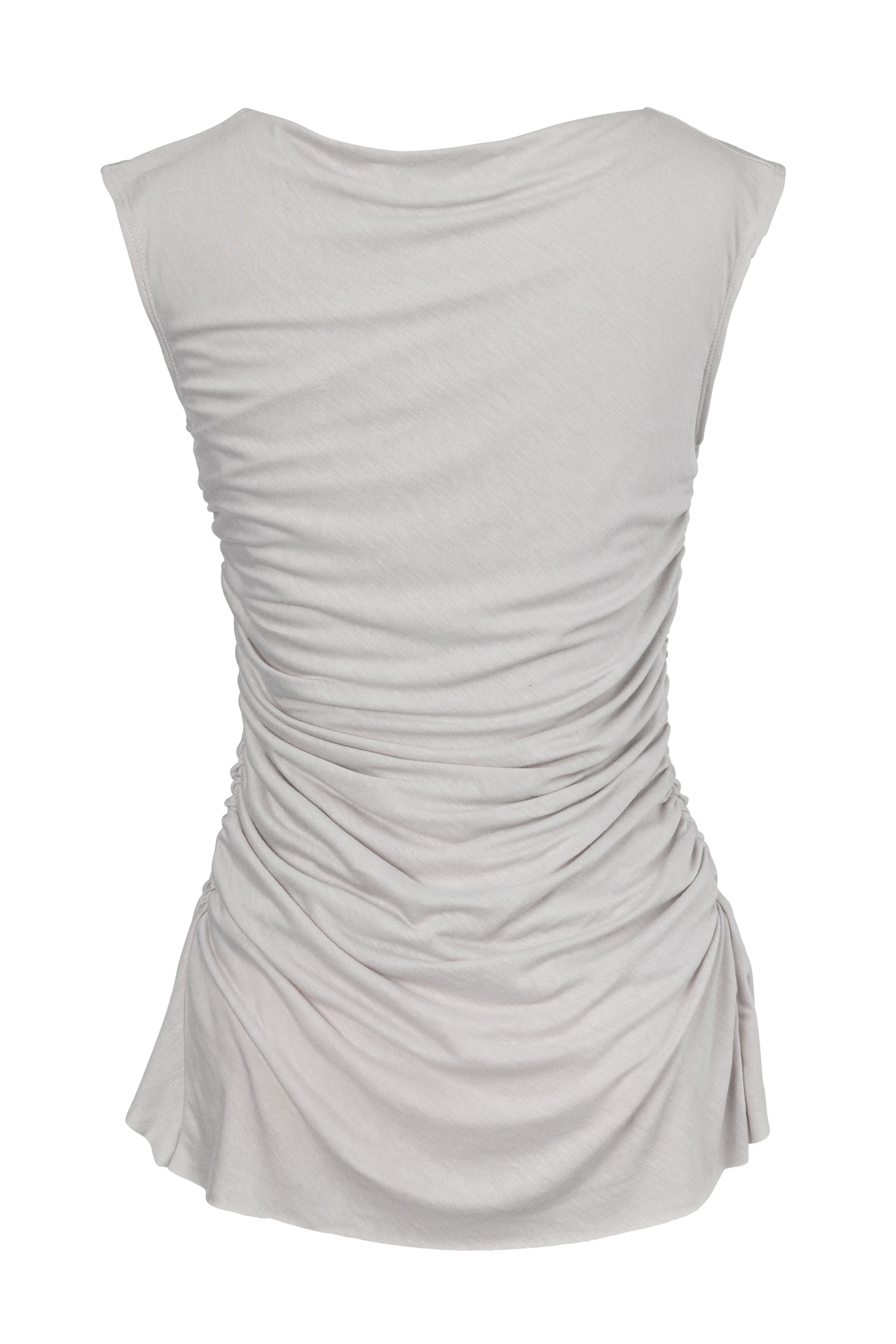 A boat-neck top with a subtle back cowl neckline, side ruching, and a high-low hemline in a bone color. Made from 100% deadstock fabric. 