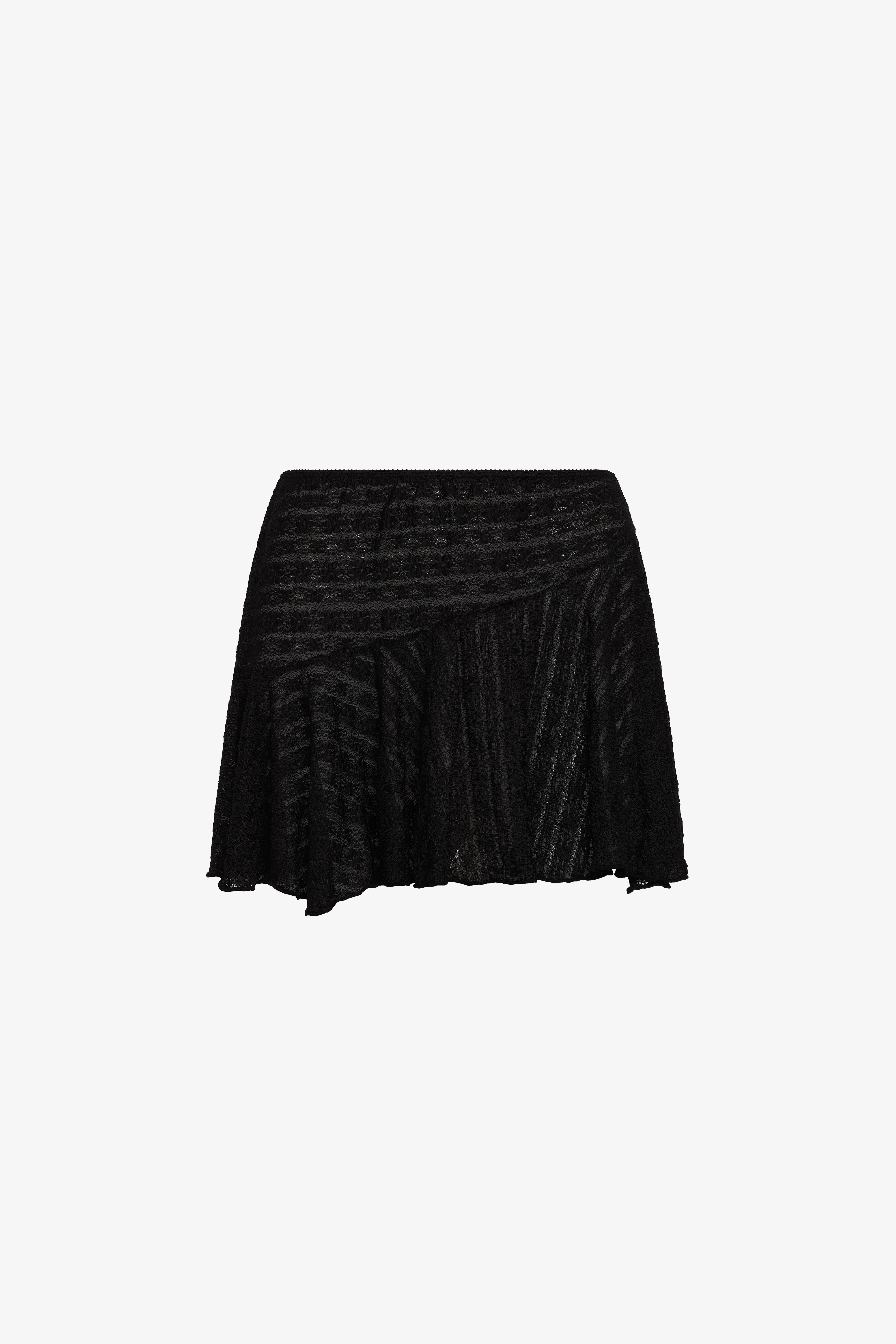 The black dreamwave mini skirt in a white background. 100% deadstock lace material. 