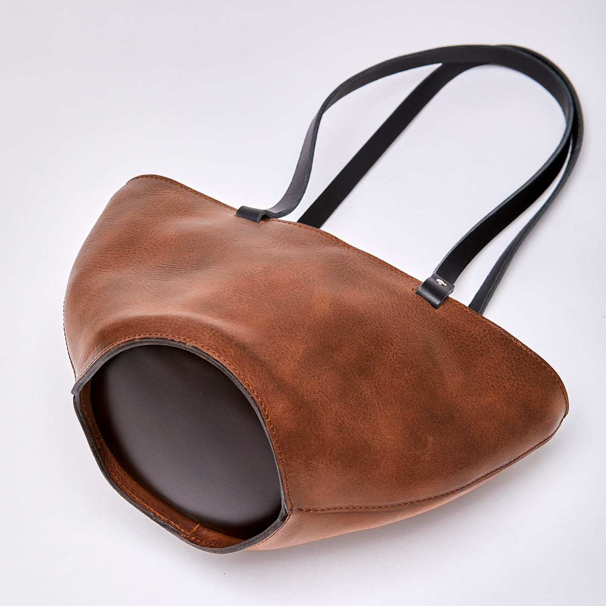 The elwin bag in a white background. Crafted from chrome-free leather.