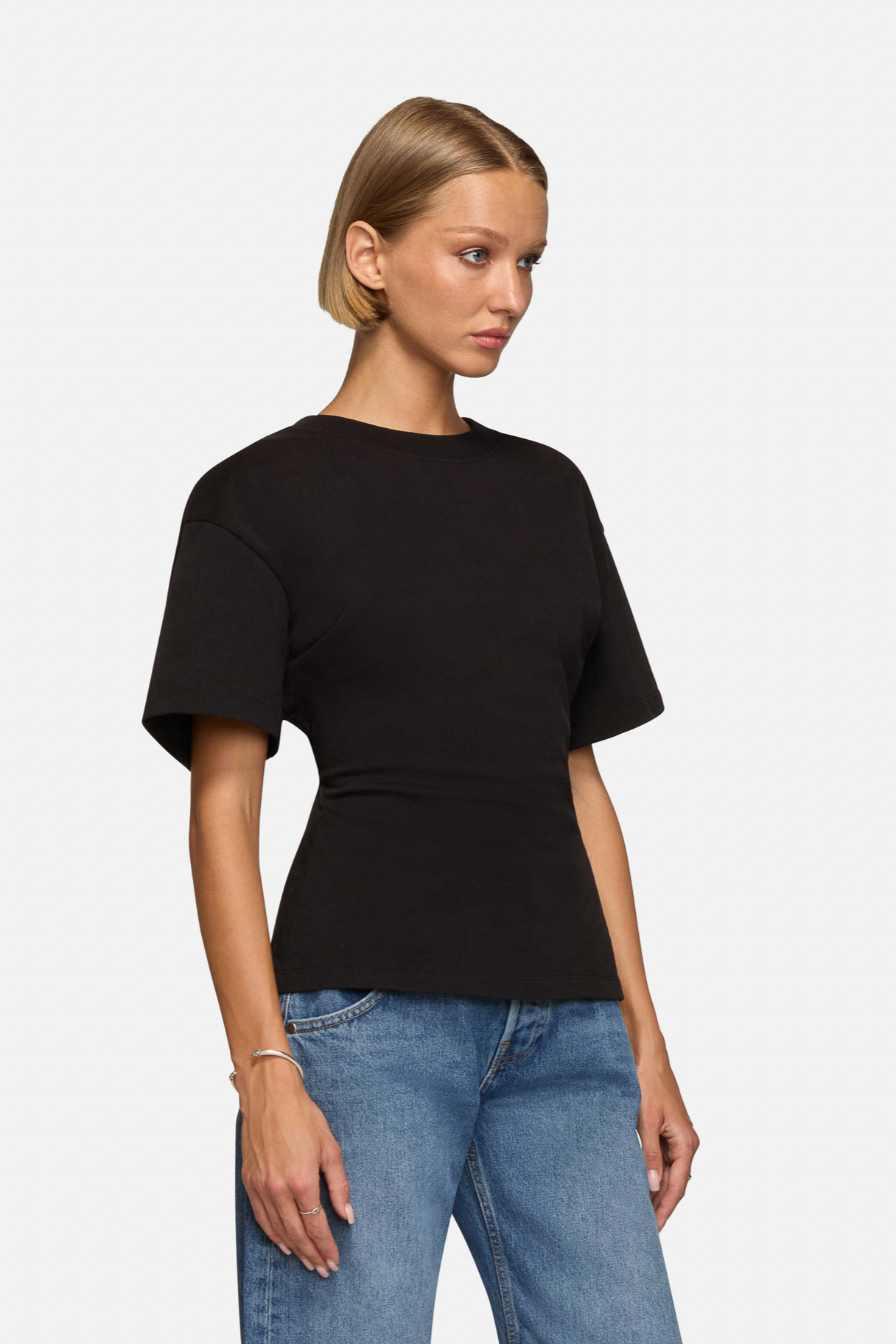 A model wearing the black eero tee in a white background. 100% made from cotton. 