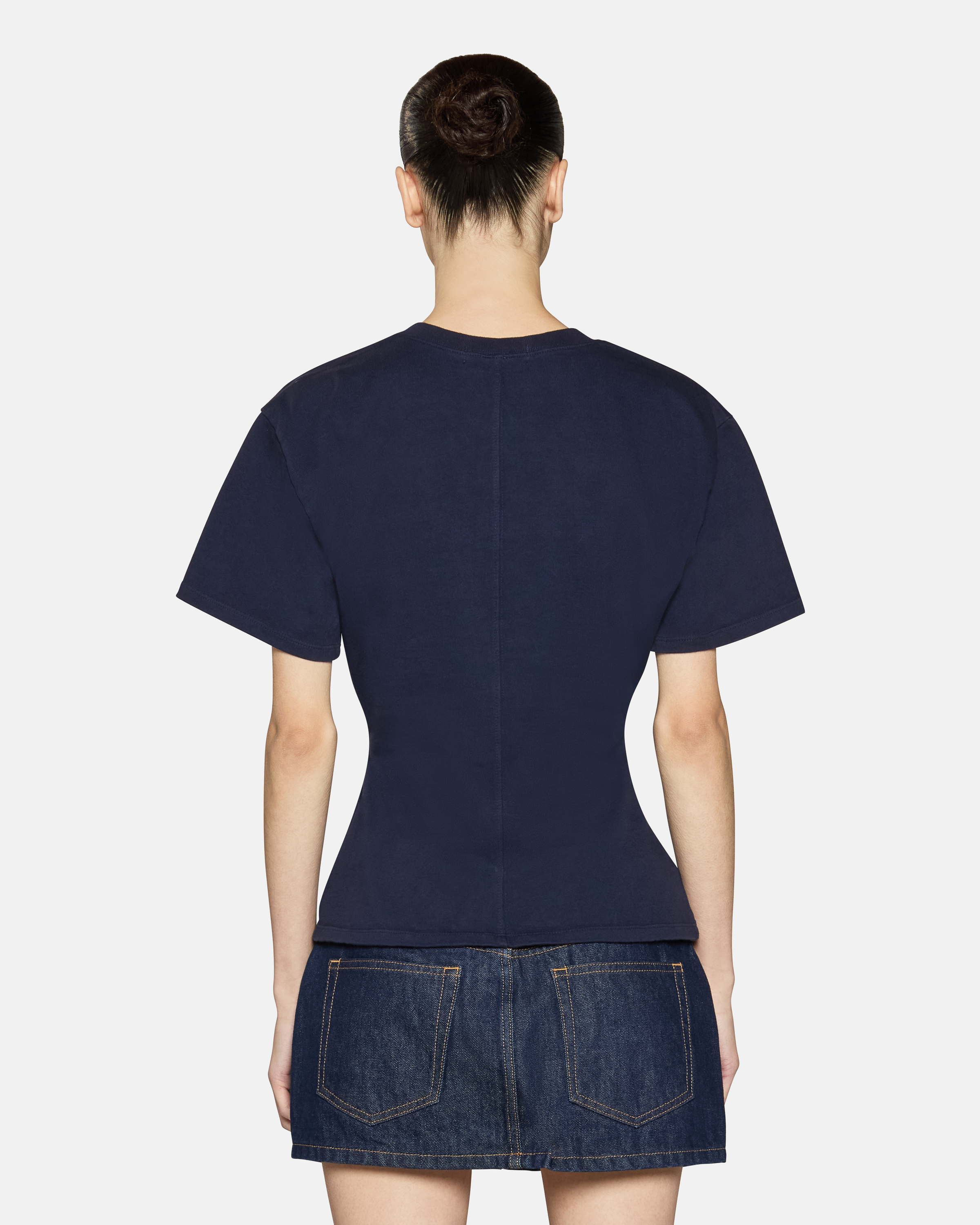 A model wearing the navy eero tee in a white background. 100% made from cotton.