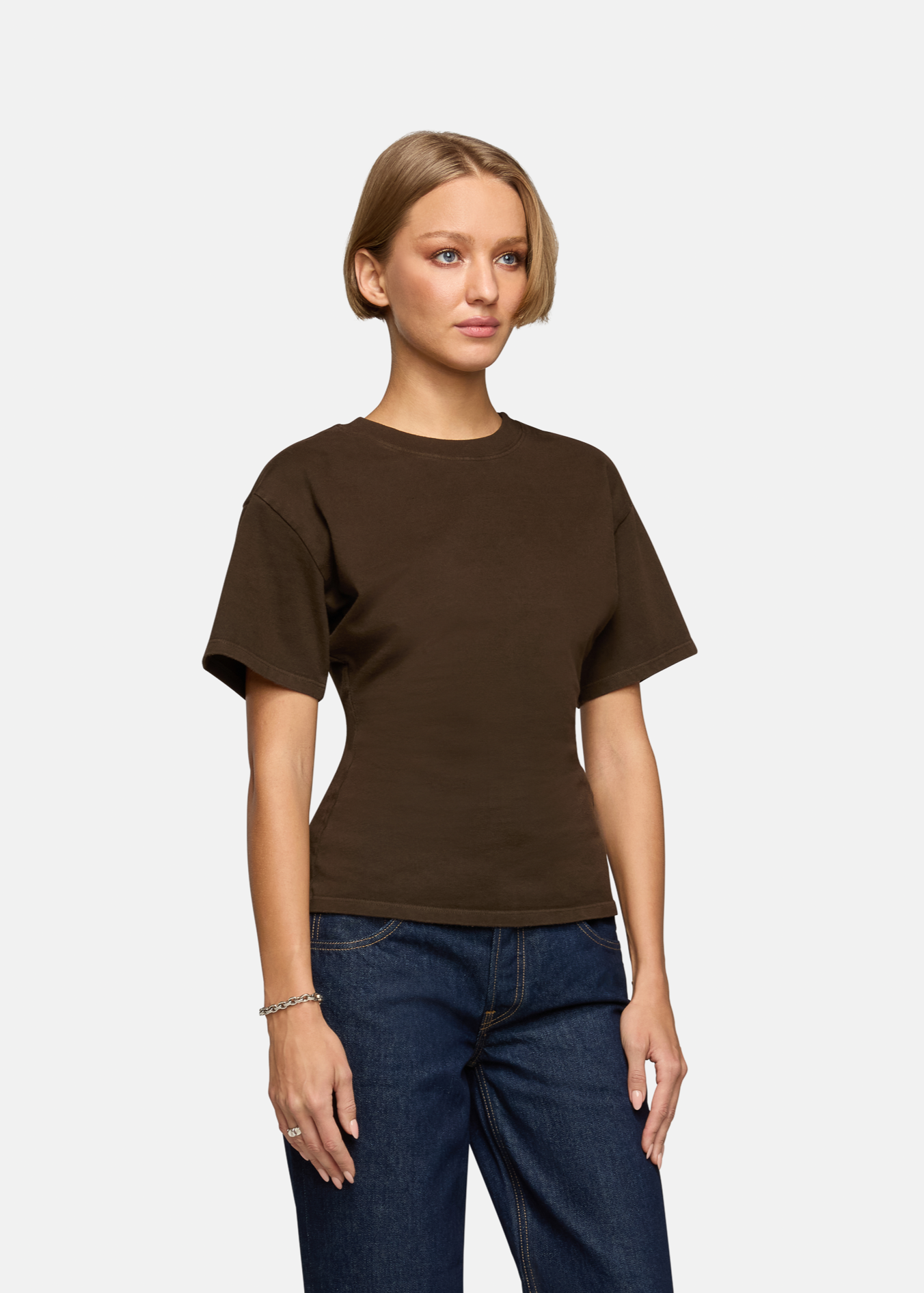 A model wearing the saddle eero tee in a white background. 100% made from cotton.