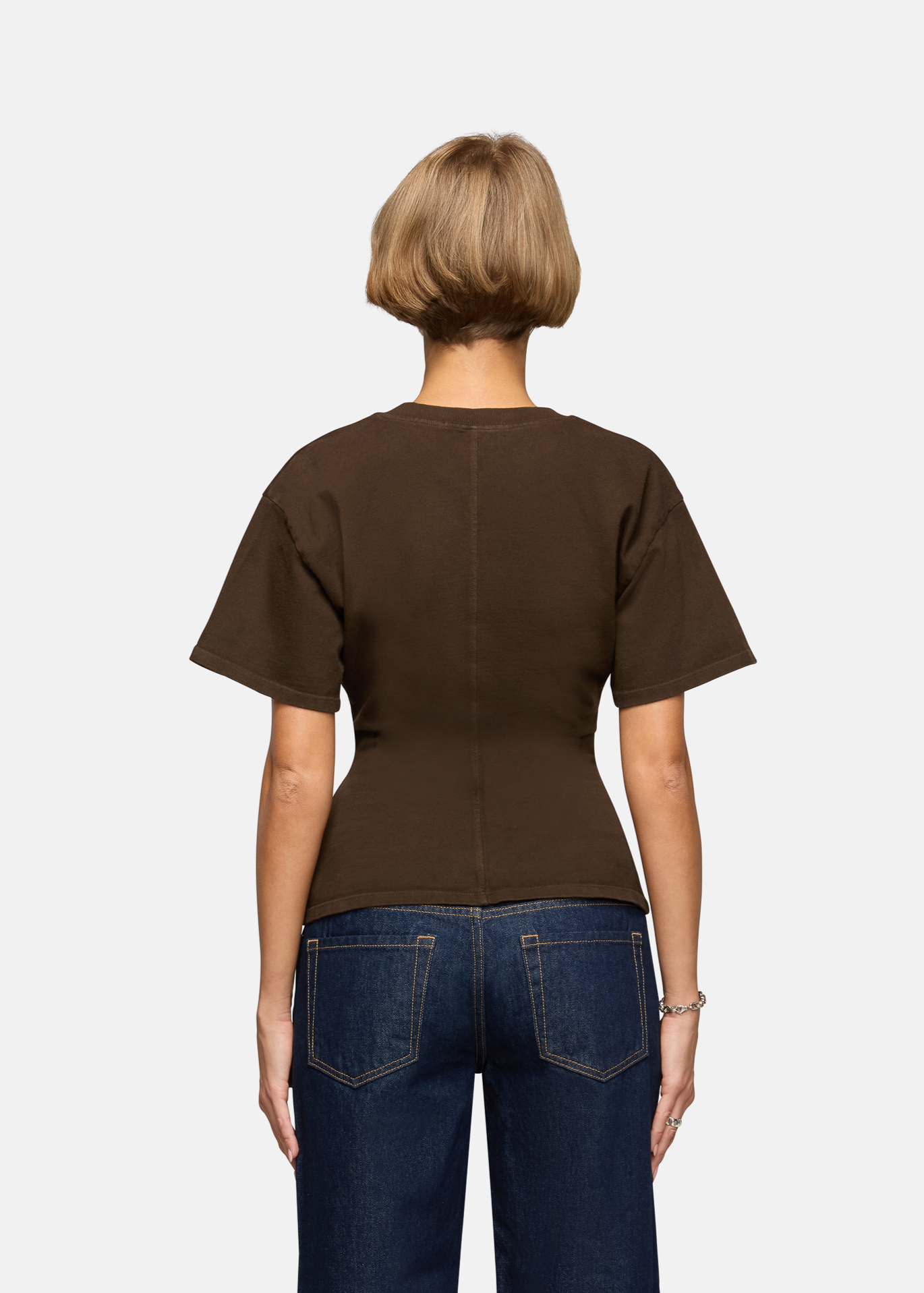 A model wearing the saddle eero tee in a white background. 100% made from cotton.