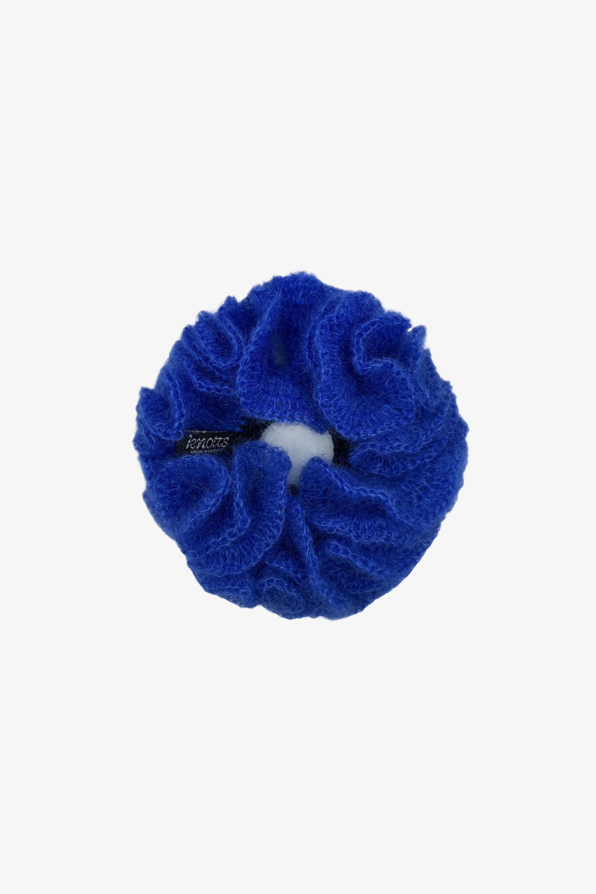 The eva scrunchie in a white background. Handmade in London!