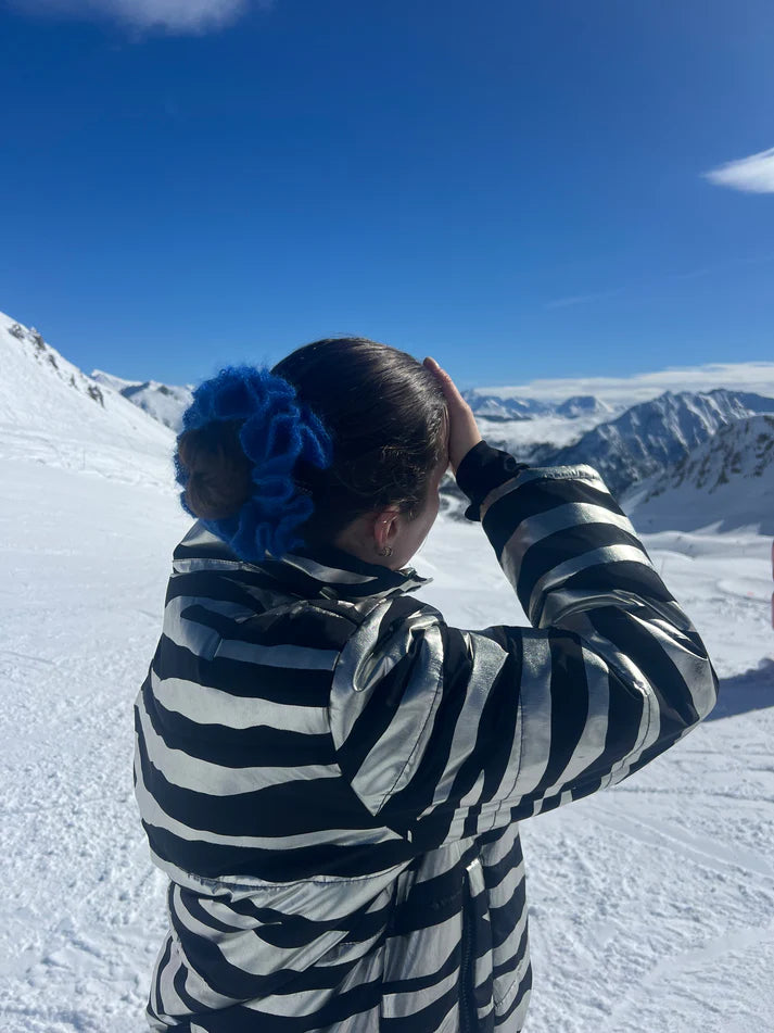 A model wearing the eva scrunchie in a snowy background. Handmade in London!