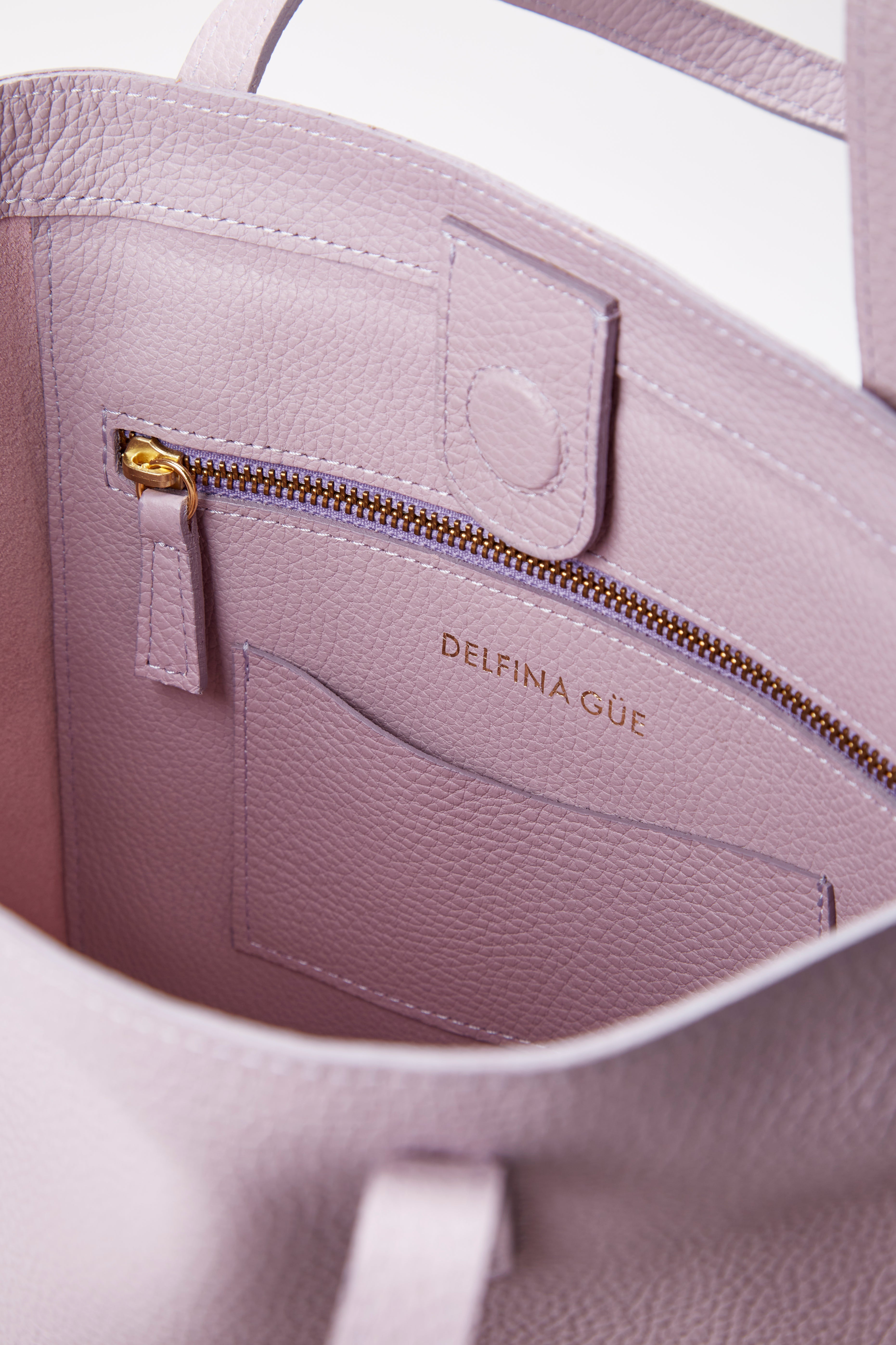 Close-up of the everything lilac bag in a white background. 100% made from deadstock leather. 