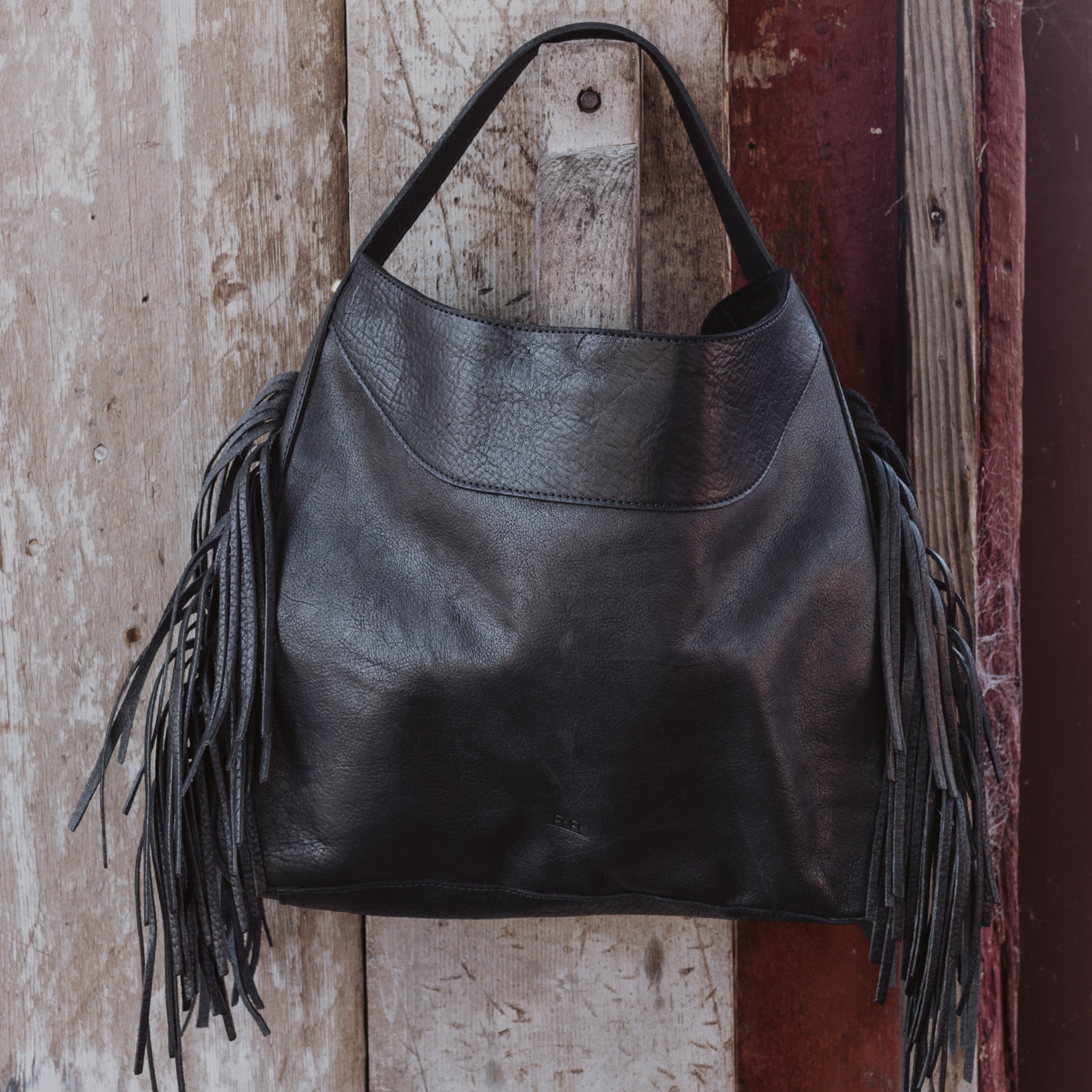 Fringe hobo on display. Leathers are sourced from regenerative ranches.