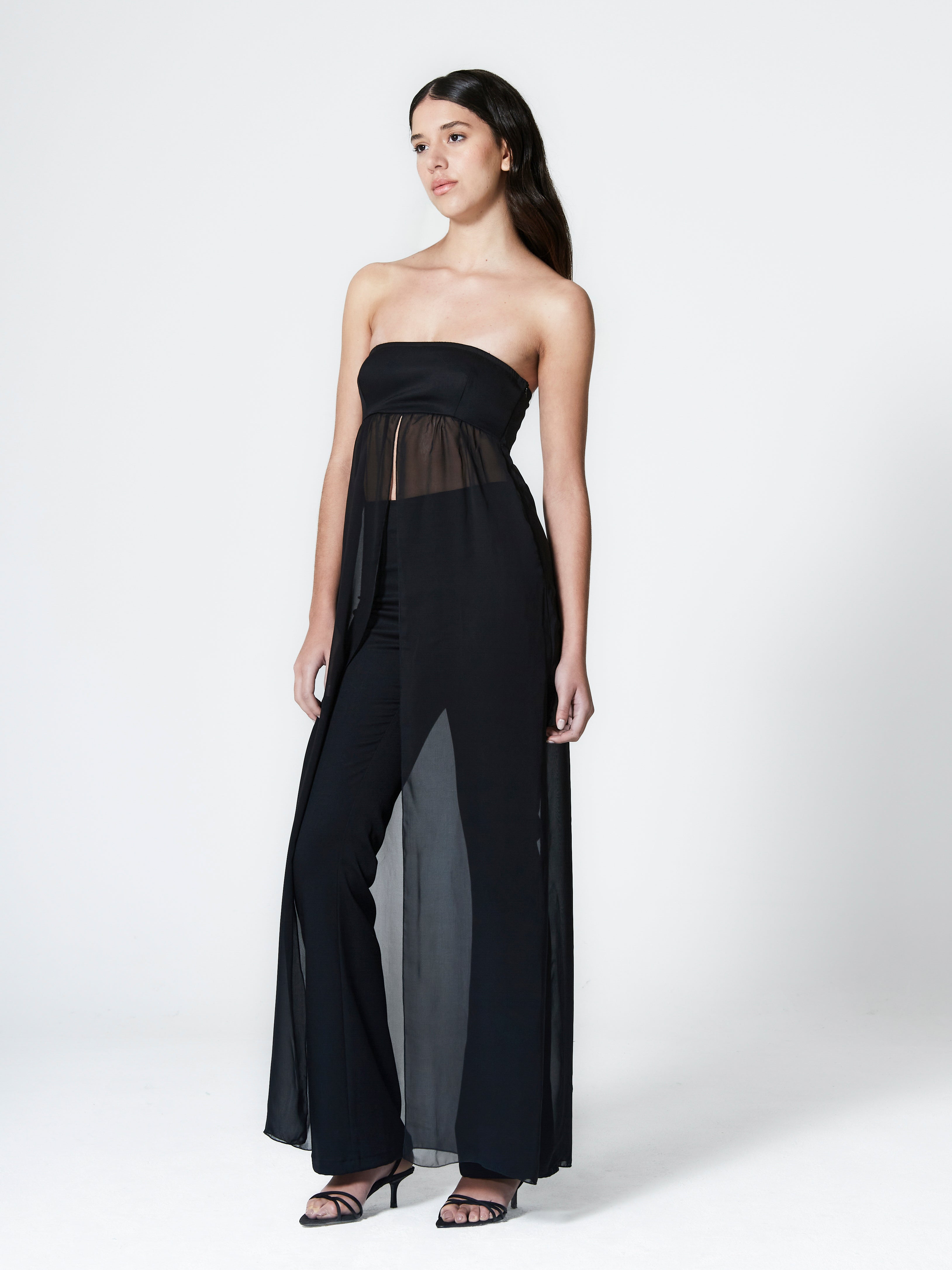 A model wearing the guilietta top in a white background. Made from fine and stretch deadstock wool paired with deadstock soft sheer viscose chiffon