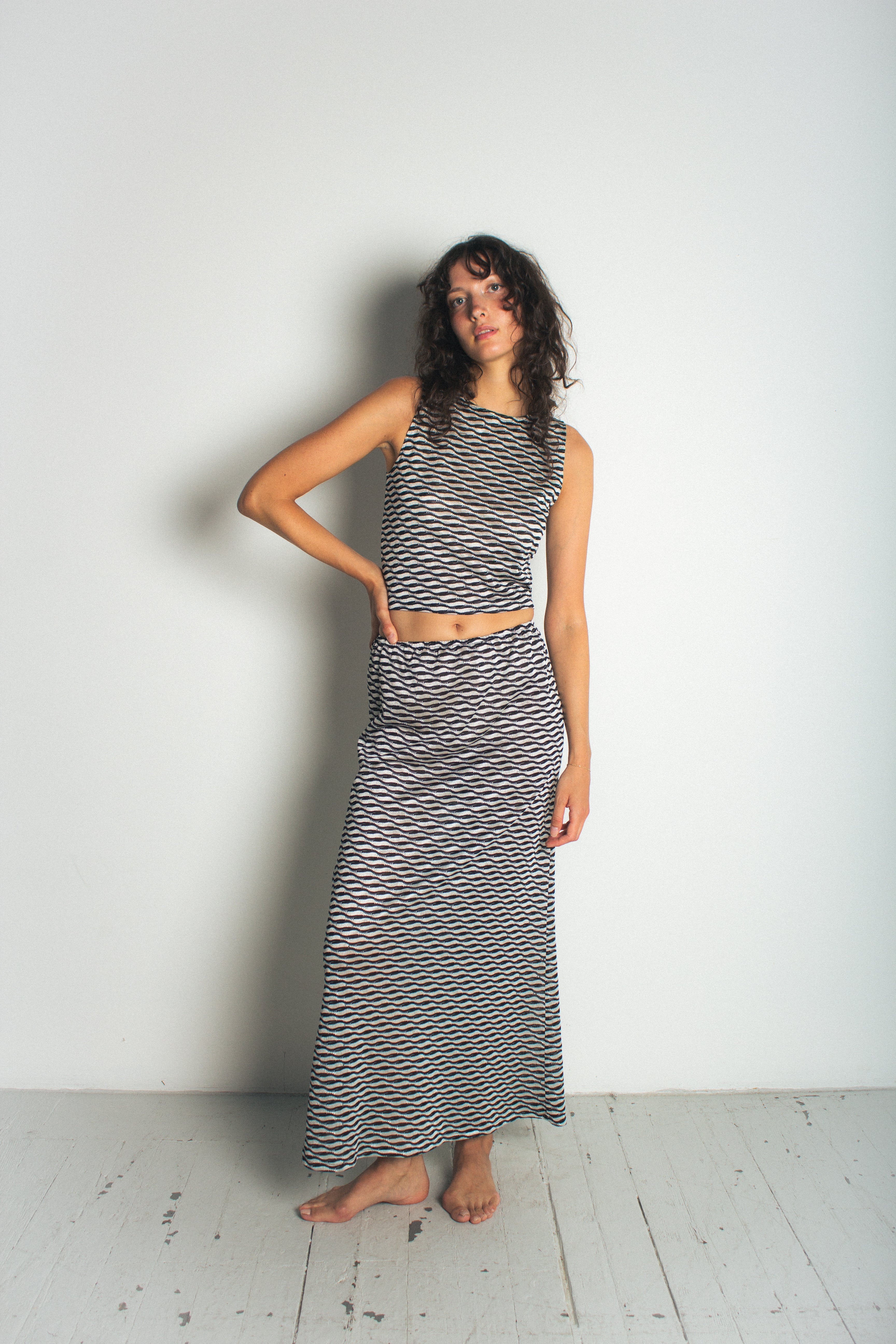 A model wearing the ivy skirt in a white background. 100% deadstock Missoni-like fabric