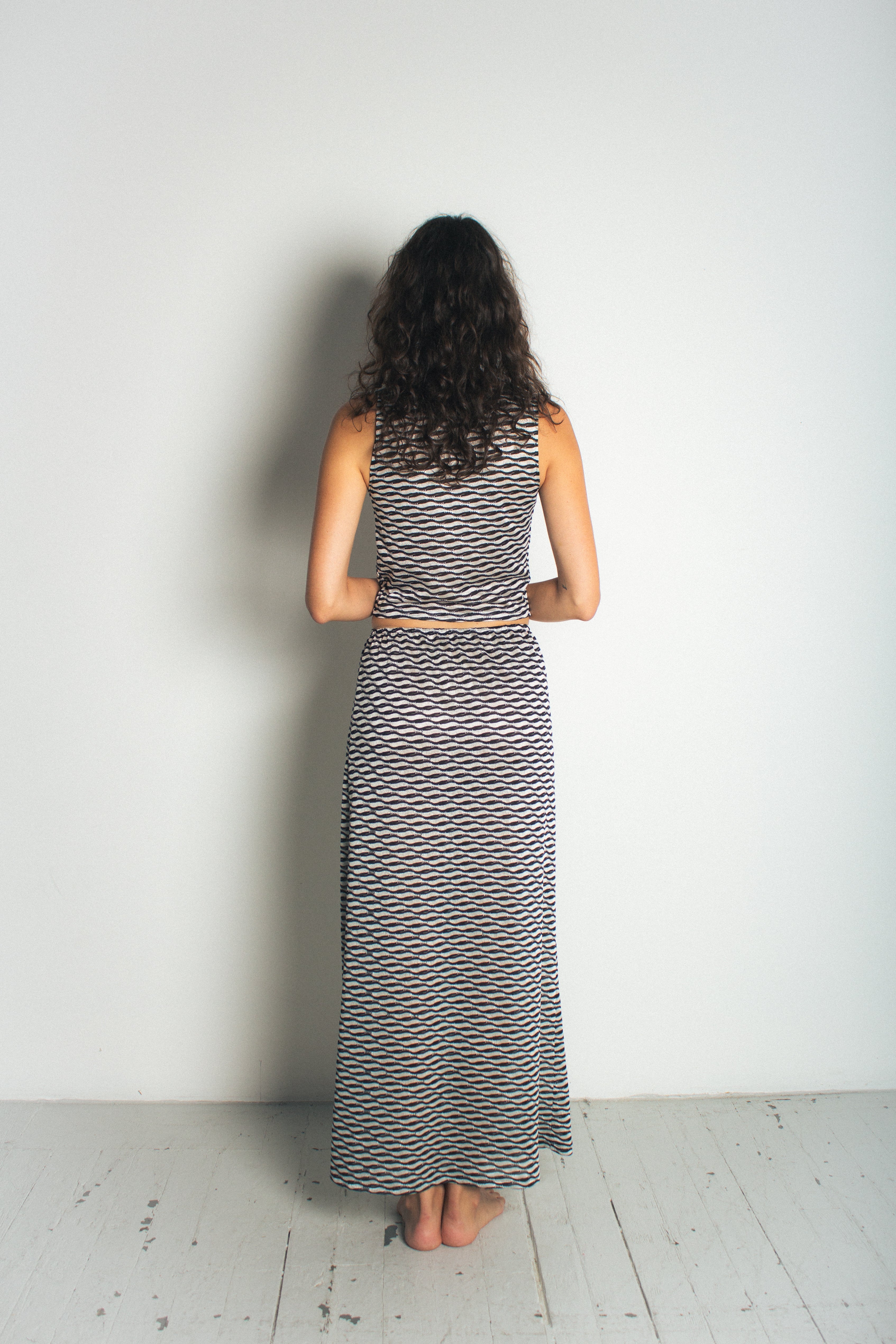 A model wearing the ivy skirt in a white background. 100% deadstock Missoni-like fabric. BACK VIEW