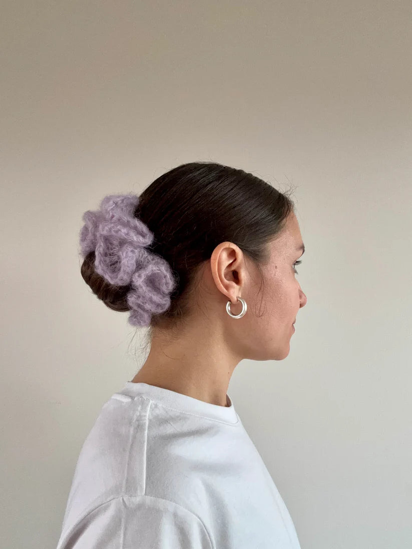 A model wearing the kayla scrunchie in a white background. Handmade in London!
