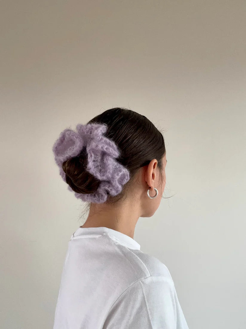 A model wearing the kayla scrunchie in a white background. Handmade in London!