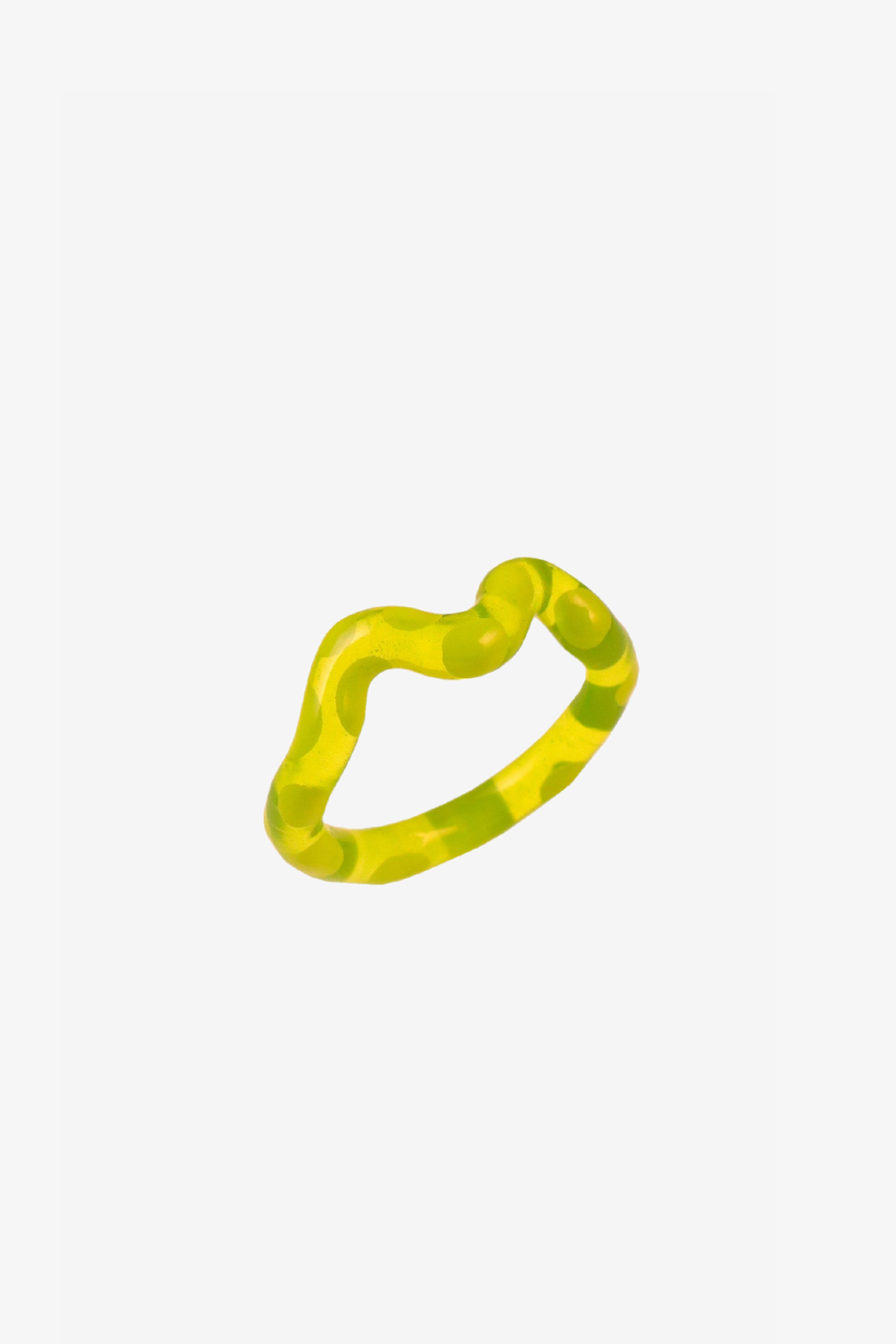 The single lime wave jelly ring in a white background. Charm are 3D printed and hand finished. Made in New York