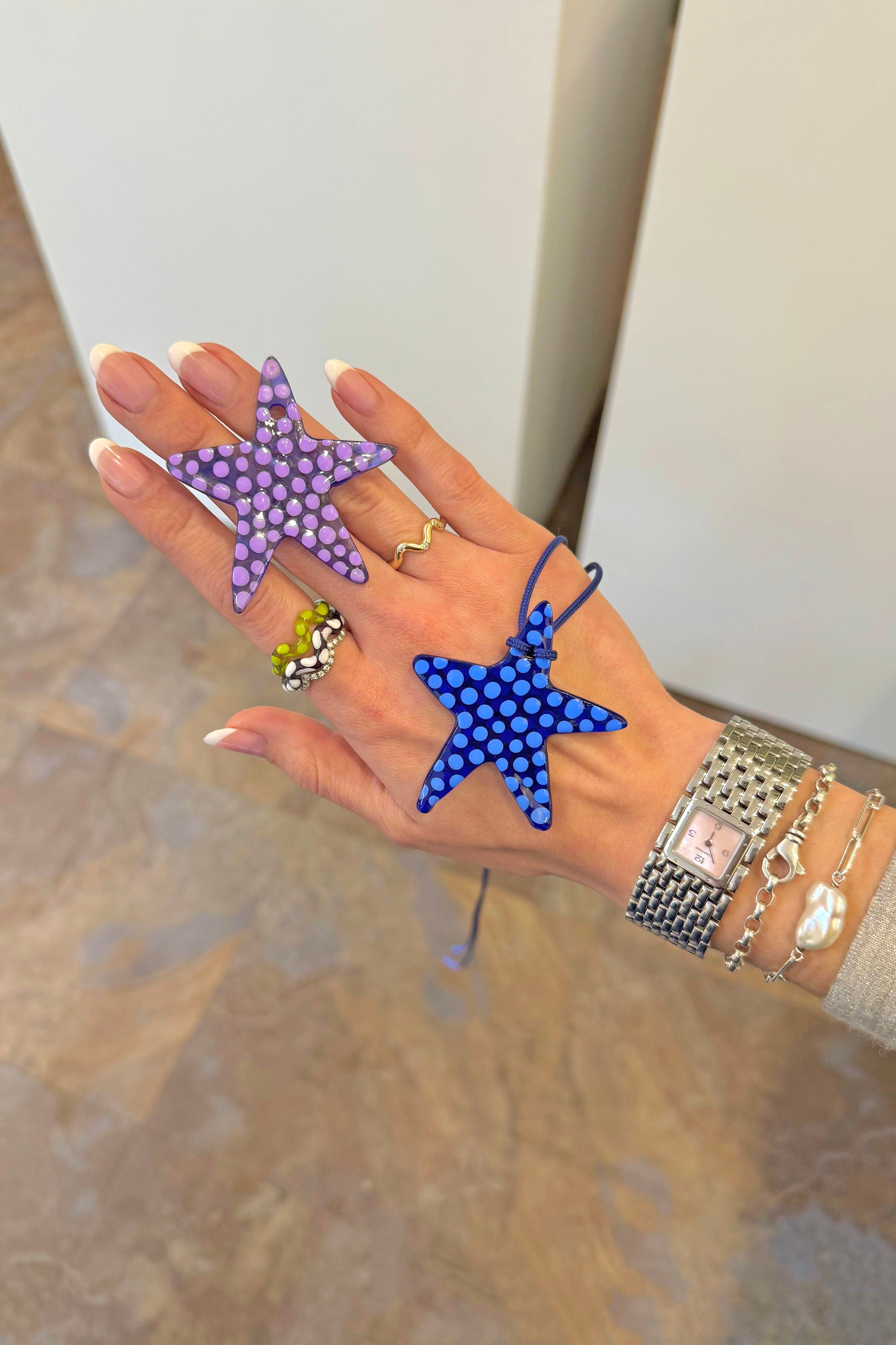 A model wearing the single lime wave jelly ring. Charm are 3D printed and hand finished. Made in New York