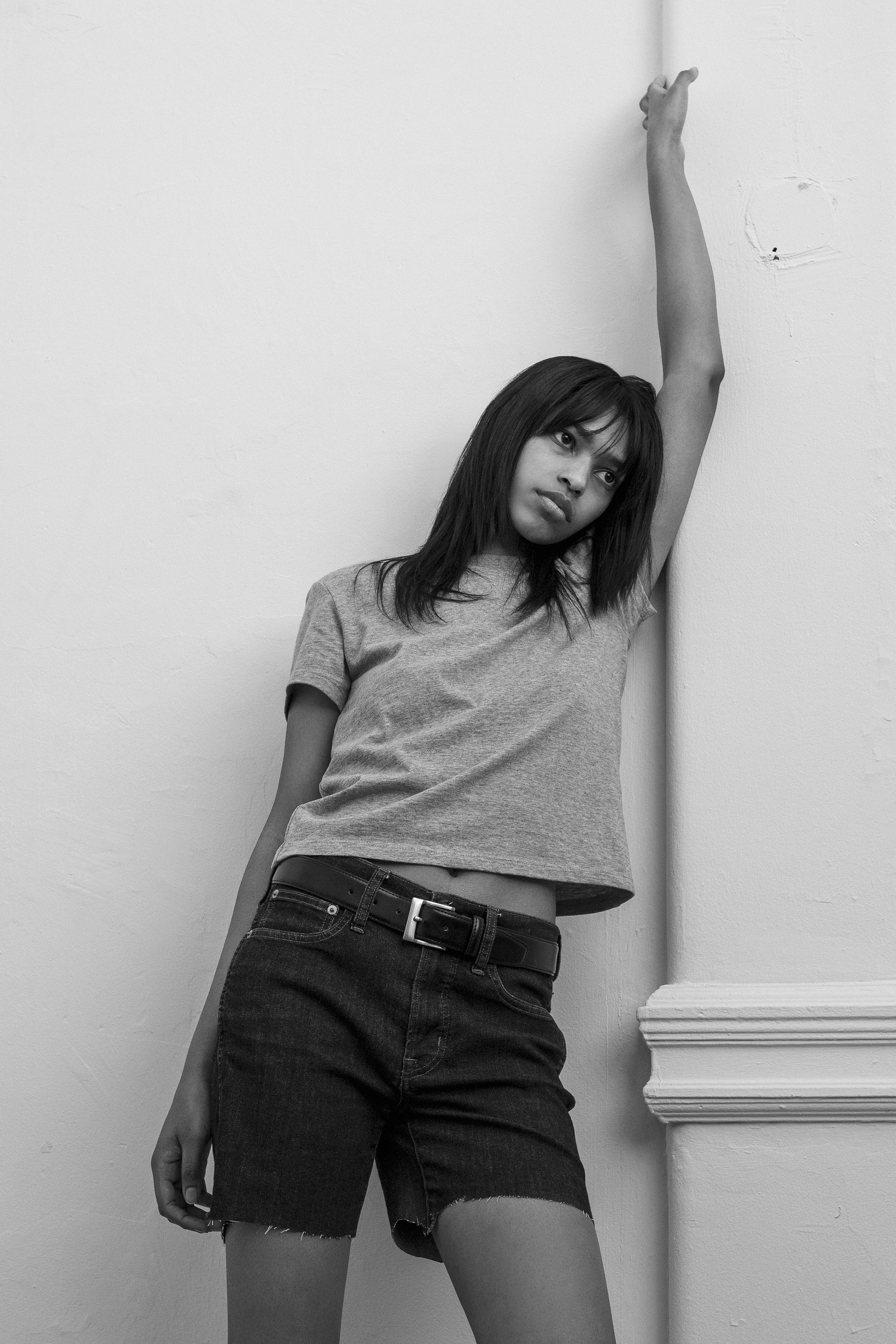 A model wearing the gray heather little tshirt in a white background. 100% made from organic grown cotton. 