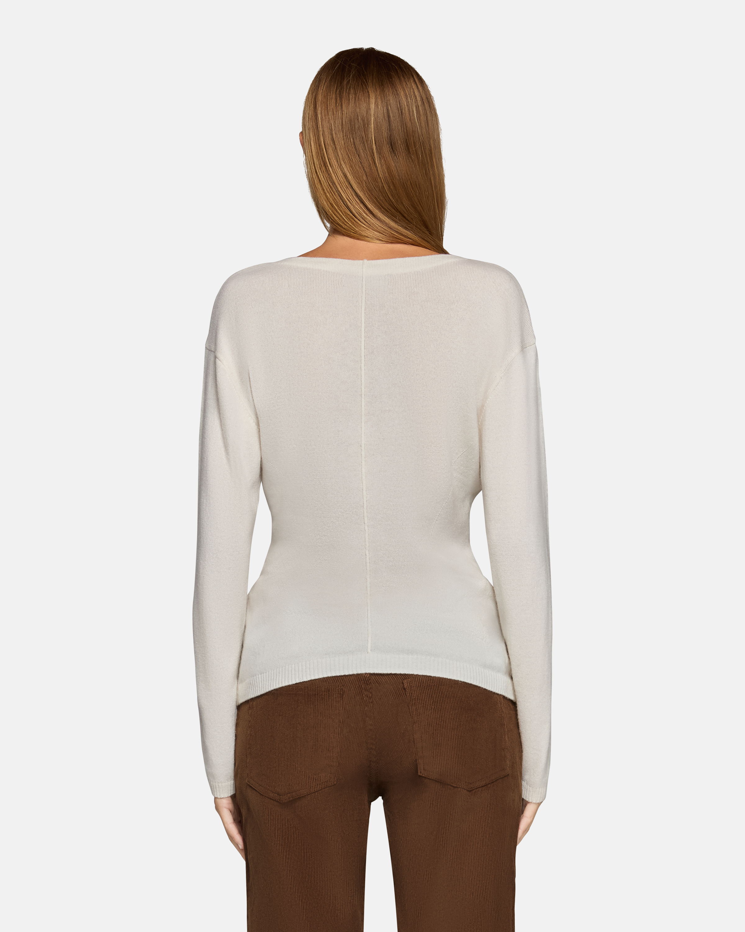 A model wearing the millie boat neck sweater in white in a white background. 100% made from cotton.