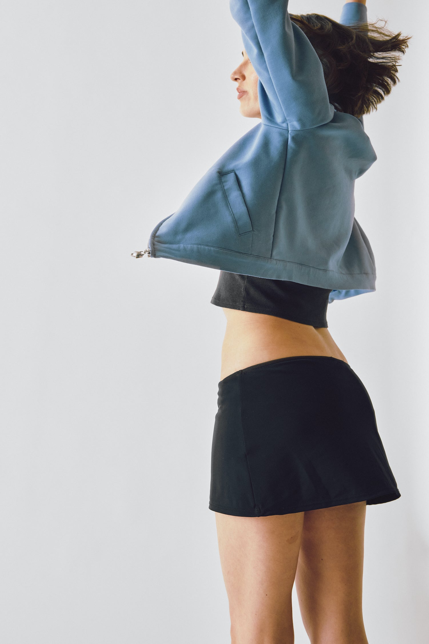 A model wearing the Miro Jacket in a white background. Deadstock wool blend with a recycled satin lining.