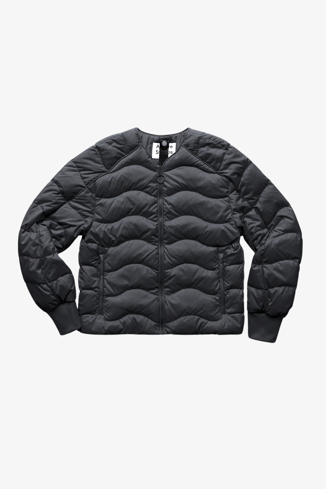 A light puffer jacket in a white background. 100% made from recycled fabric. 