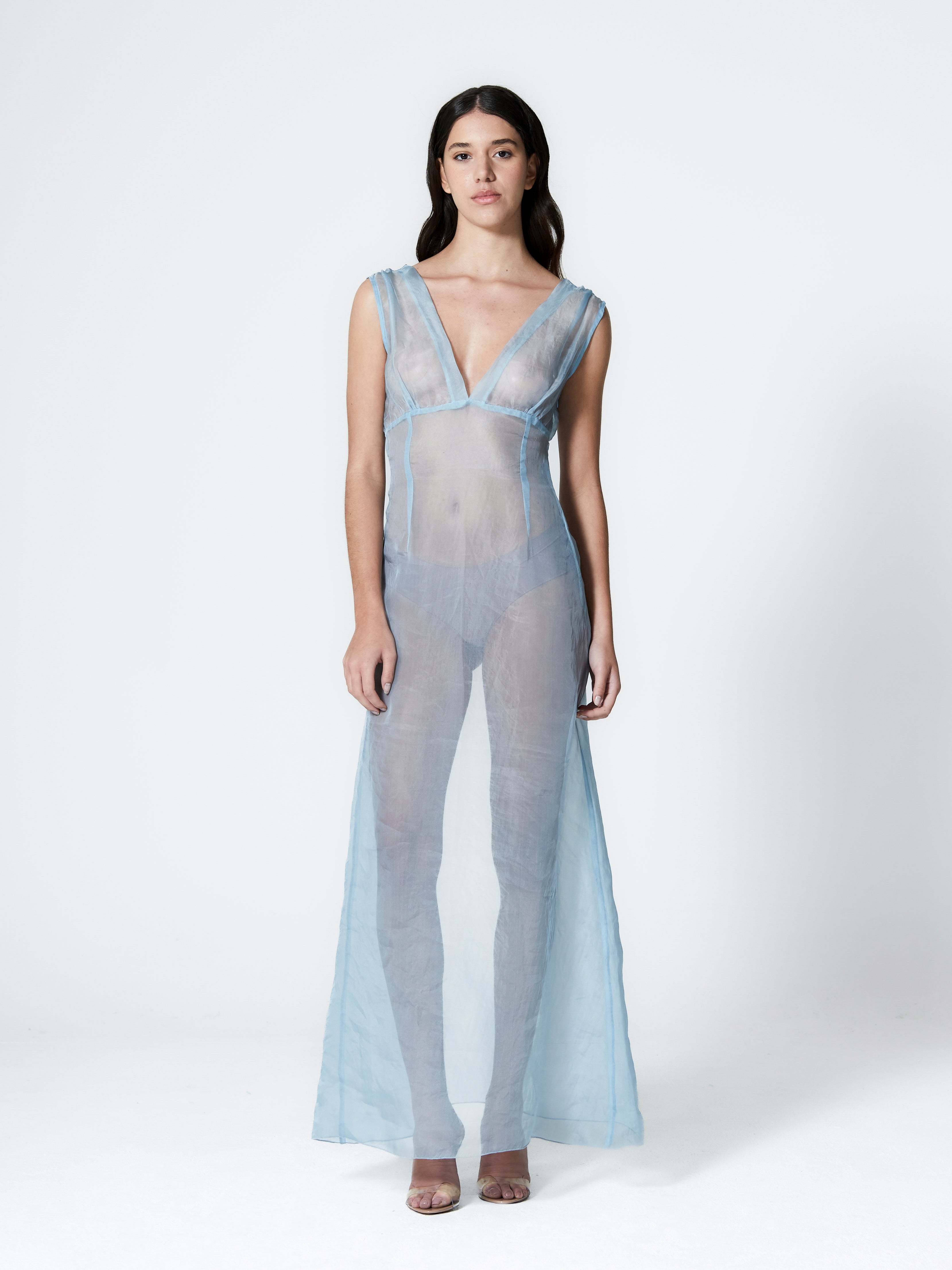 A model wearing the rose silk organza dress in a white background. 100% made from lightweight deadstock silk organza fabric