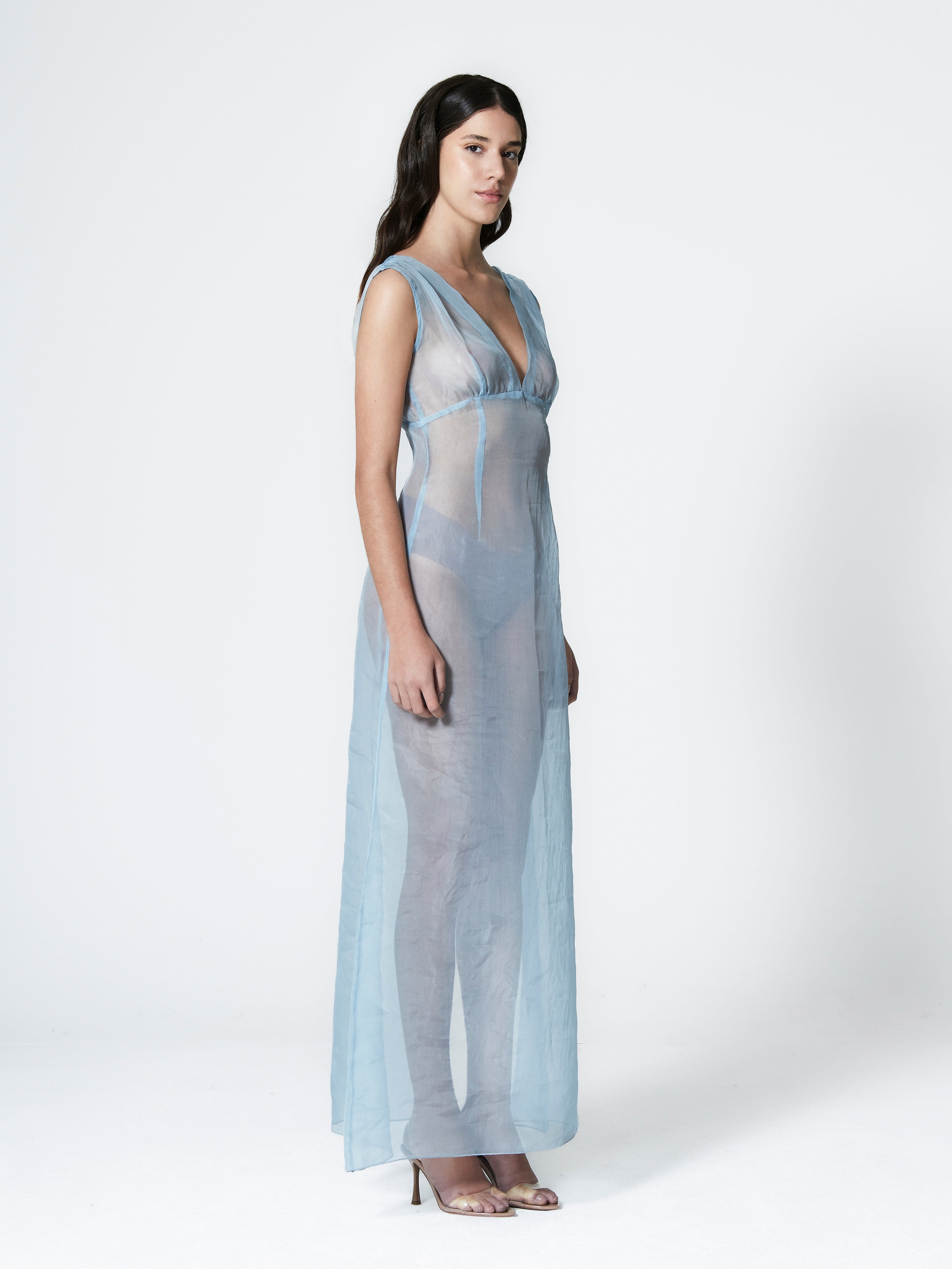 A model wearing the rose silk organza dress in a white background. 100% made from lightweight deadstock silk organza fabric