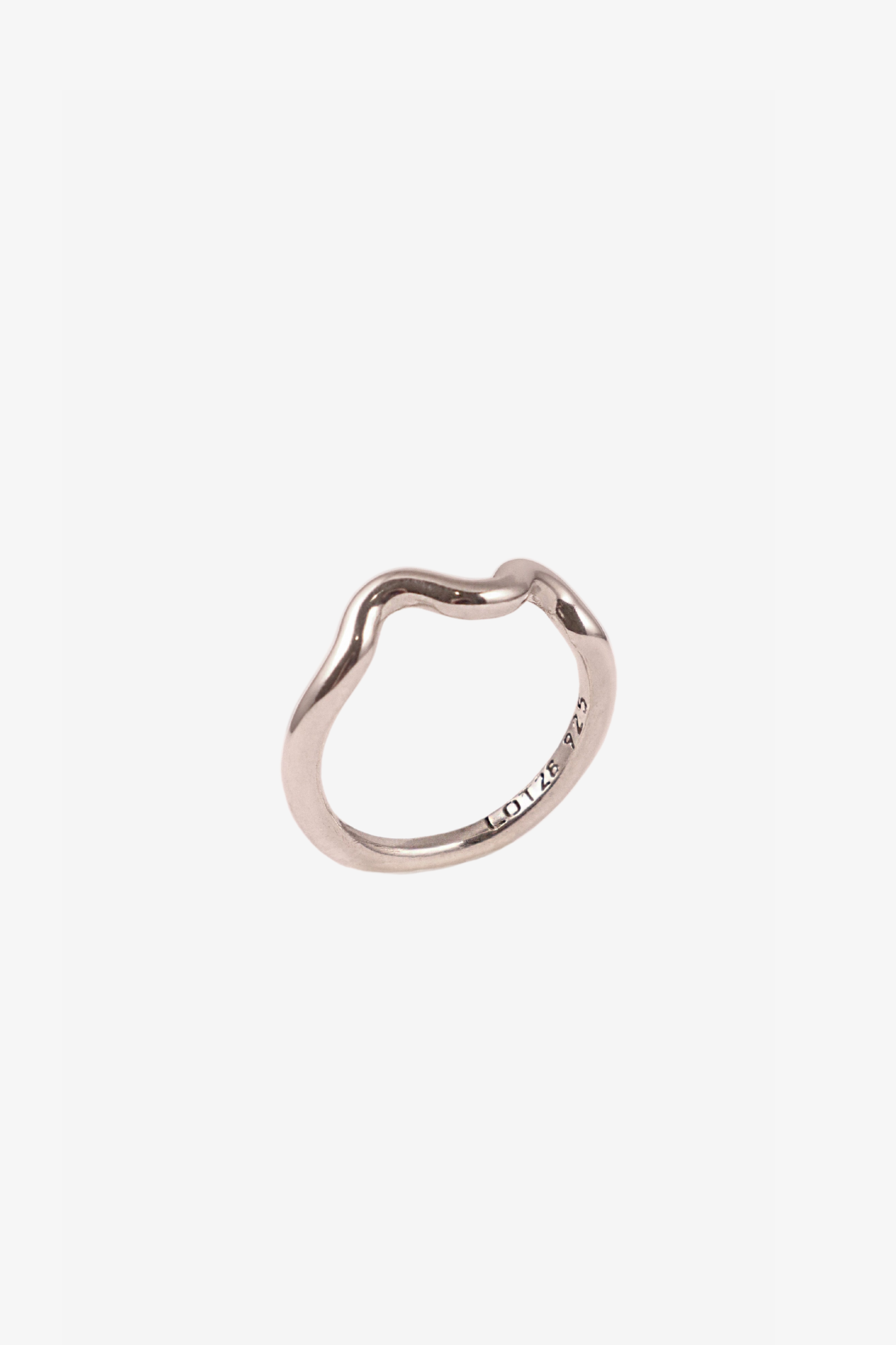 The single wave silver ring in a white background. Made from 100% recycled metals
