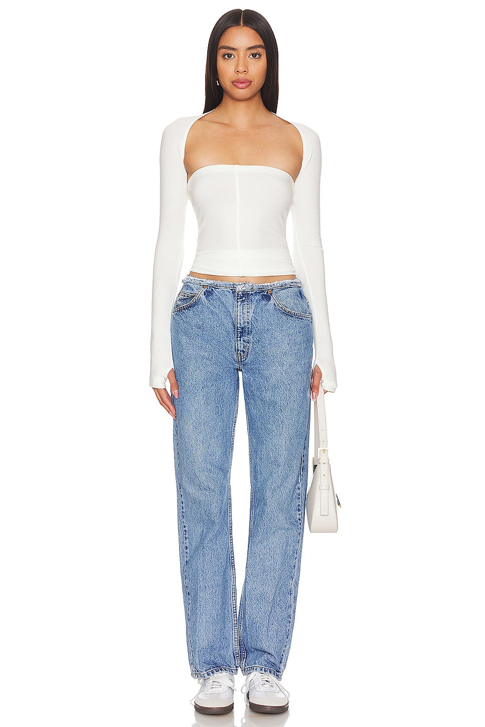 Model wearing an undone mini rise customs in a white background. 100% made from repurposed Levi’s. 