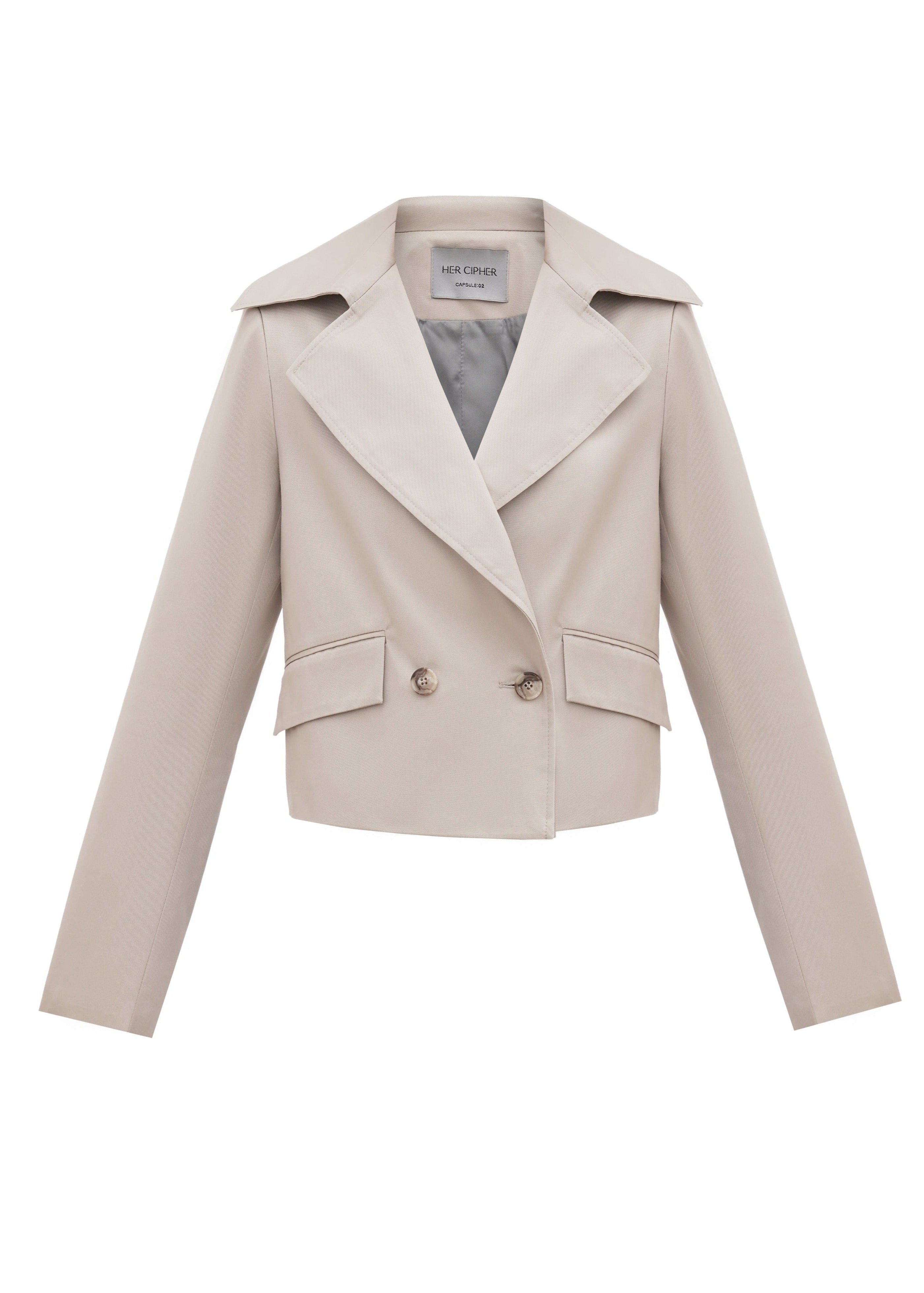 A front of a SeaSycle cropped jacket by HER CIPHER created from resycled polyester  and organic cotton in color Sand