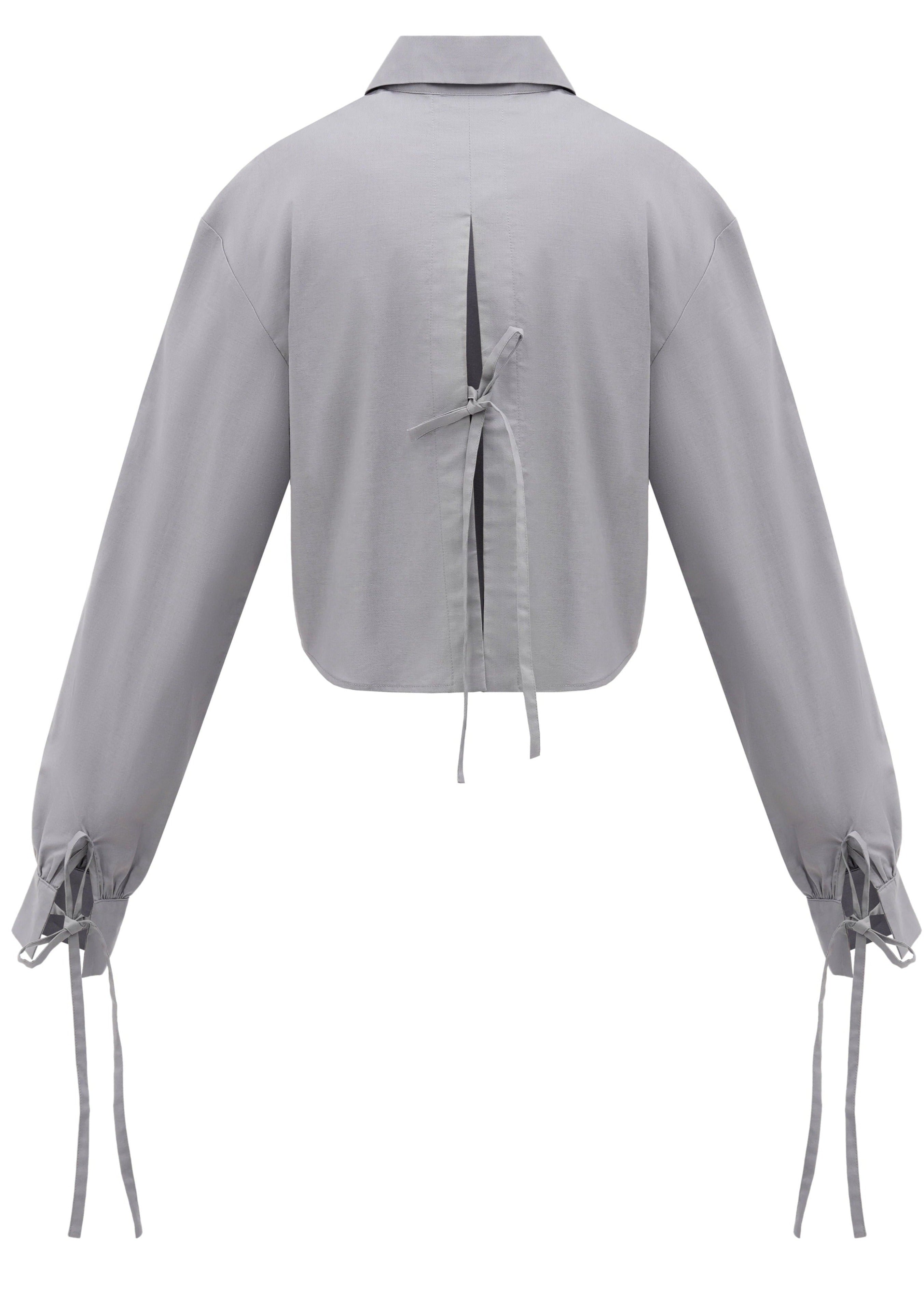 A back of a sustainable organic cotton shirt in grey color with three bow-tie details