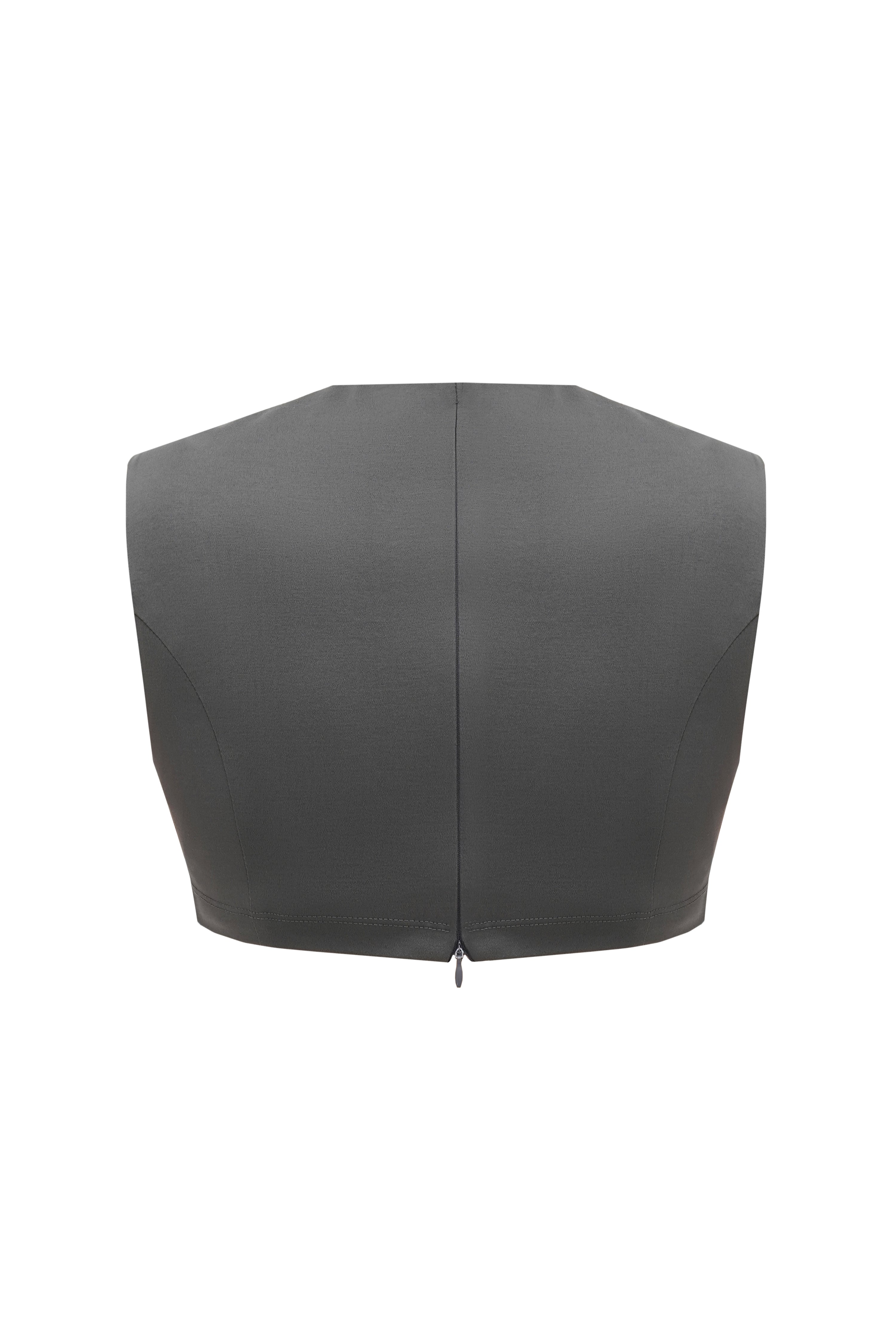 Back of a grey crop top created from sustainable organic cotton with an invisible zipper in the middle.