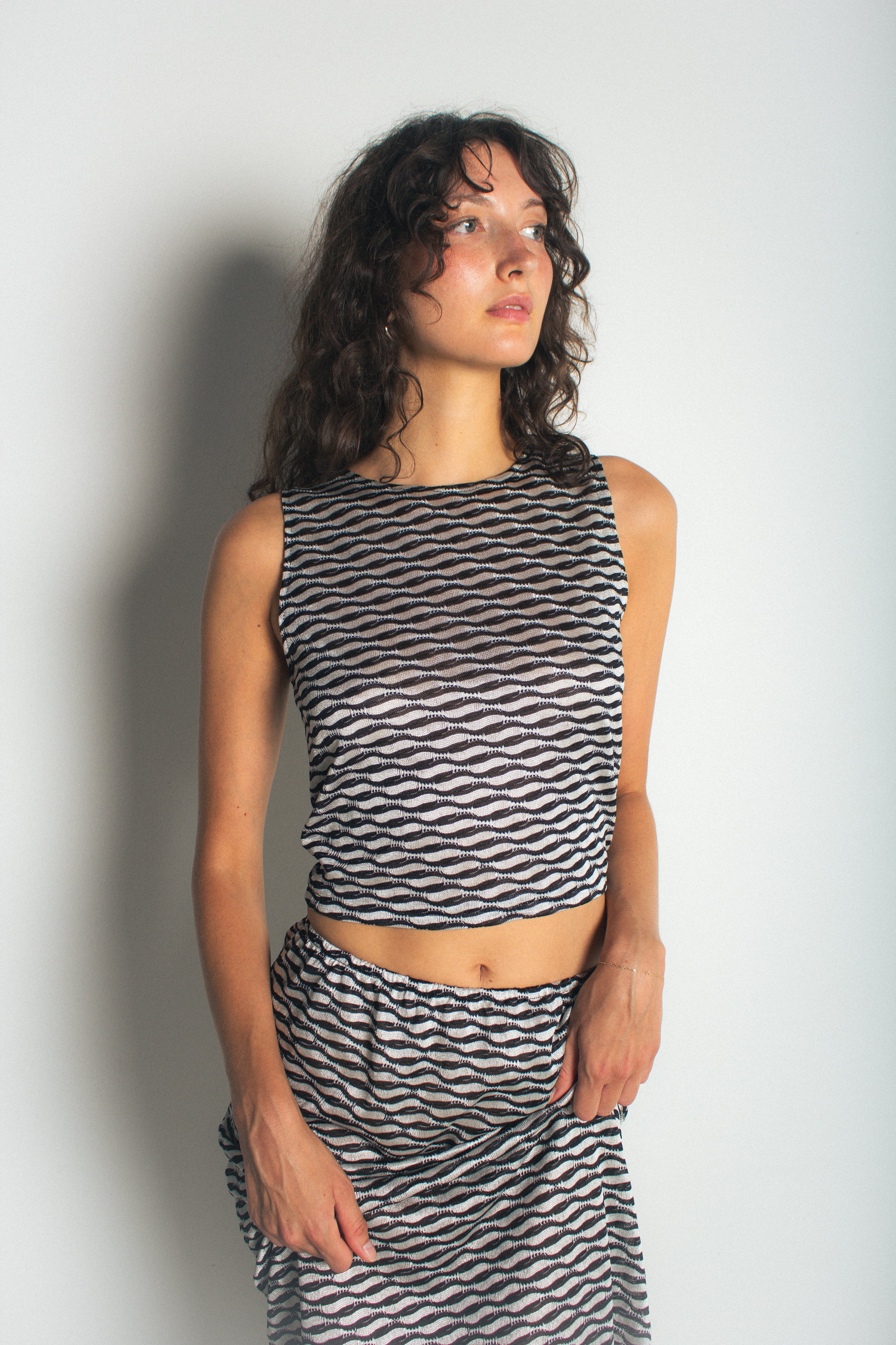 A model wearing t he ivy tank in a white background. 100% deadstock Missoni-like fabric.
