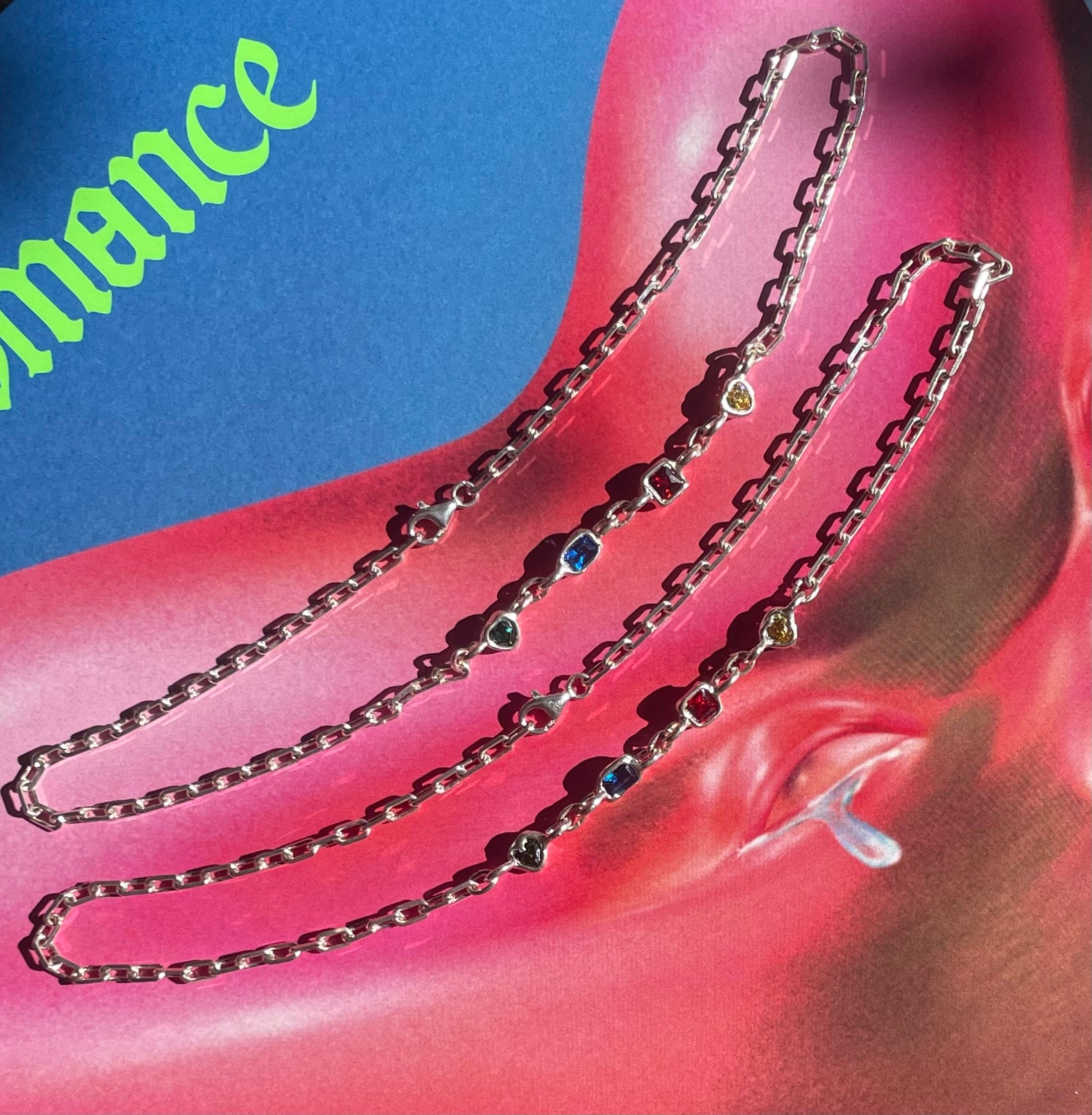 The lala necklace in an aesthetically background. Made from 100% recycled metals and lab created gemstones.