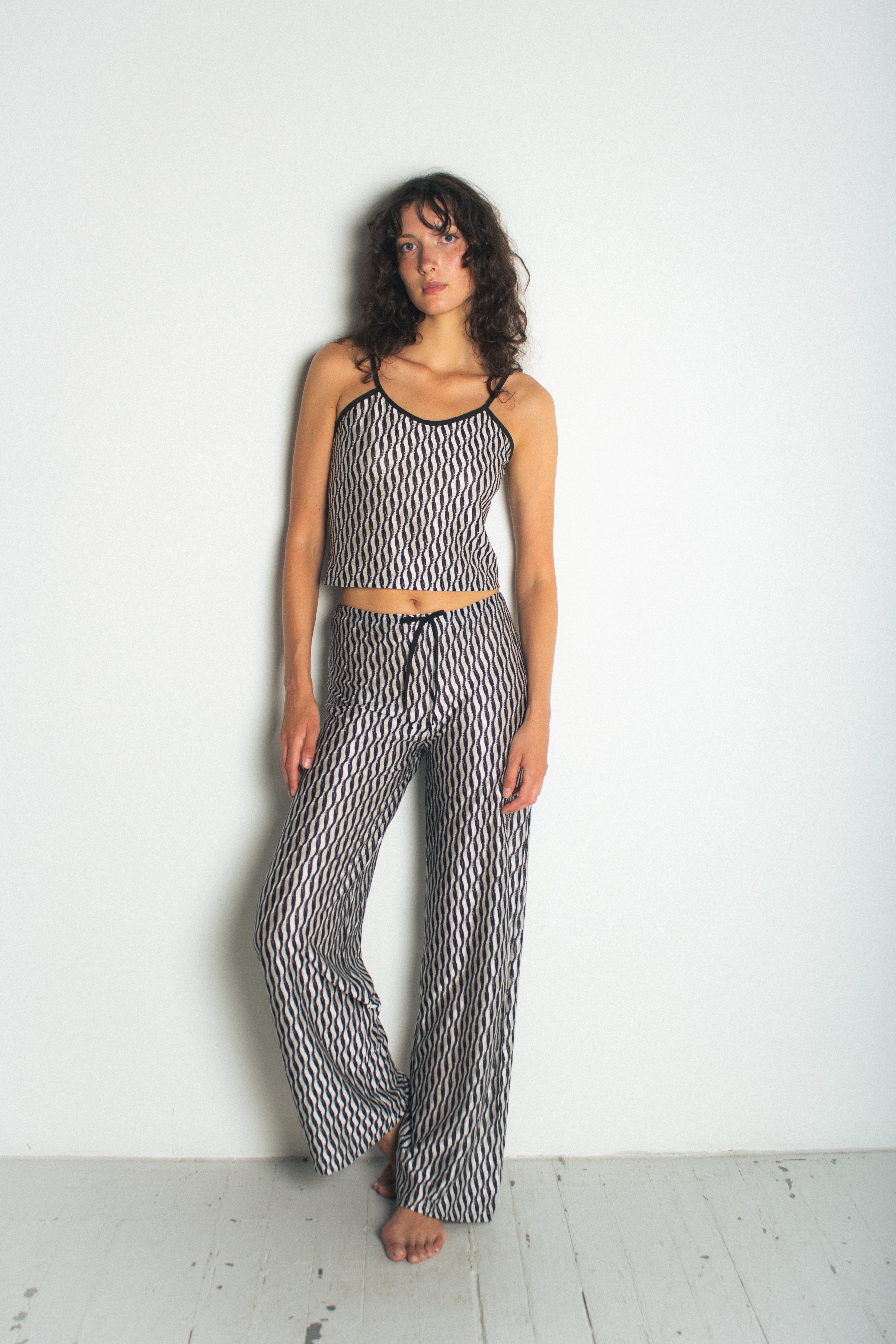 A model wearing the lola tank in a white background. 100% deadstock Missoni-like fabric