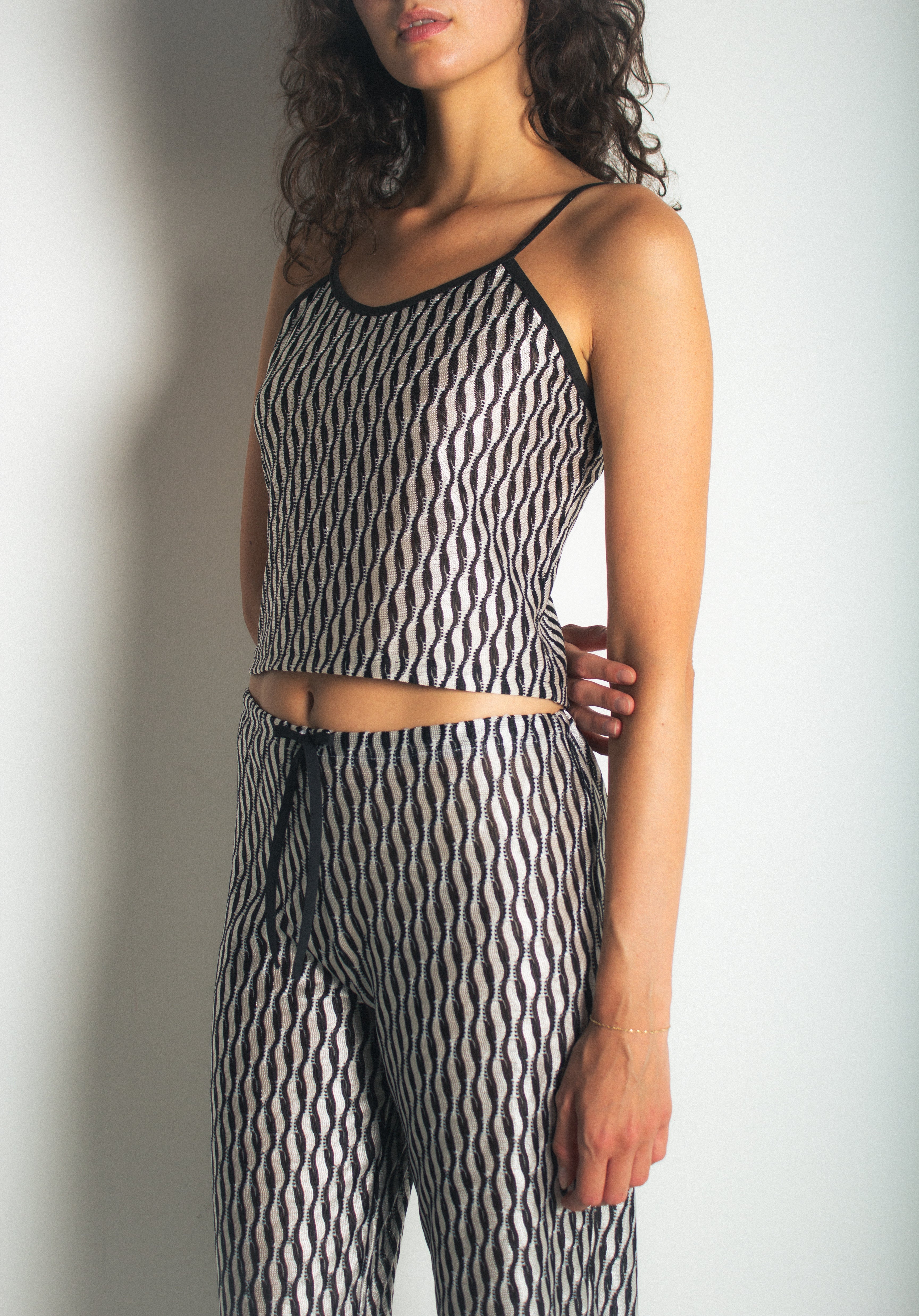 A model wearing the lola tank in a white background. 100% deadstock Missoni-like fabric. CLOSE-UP