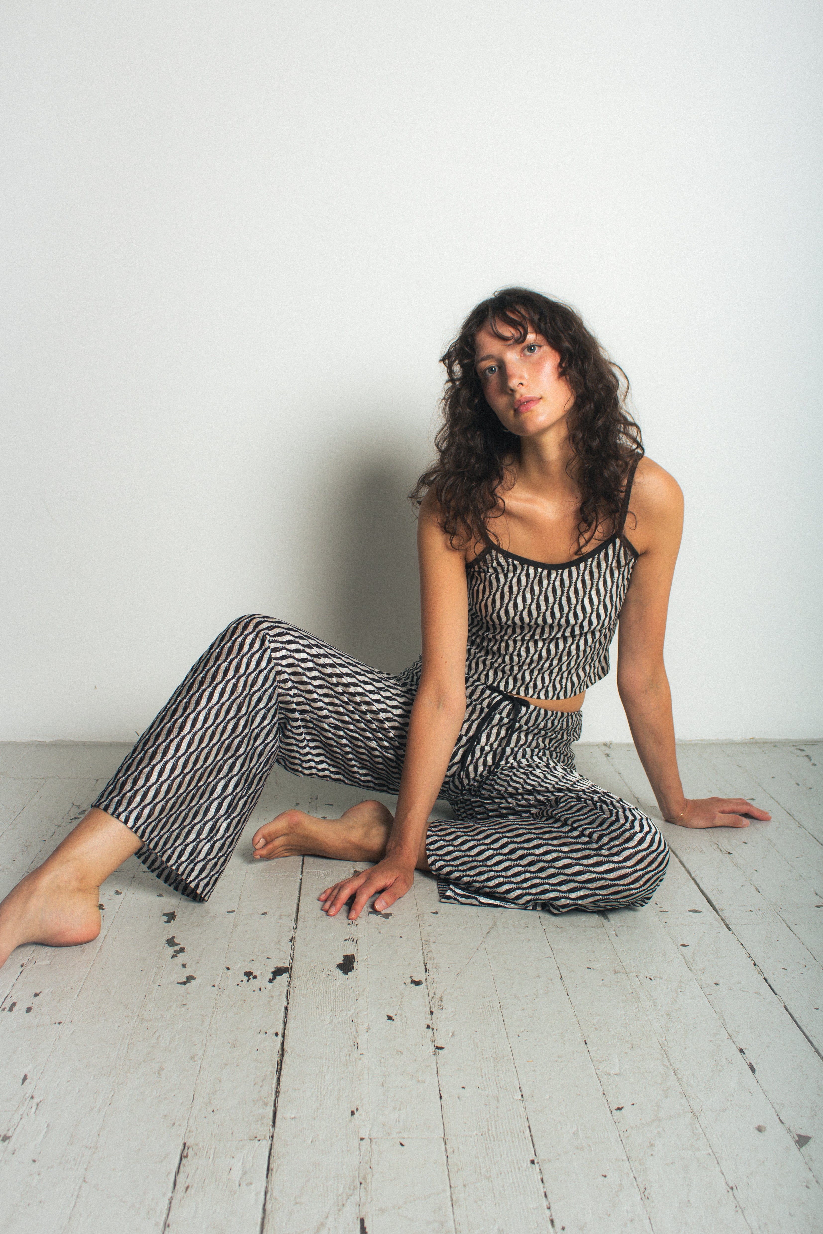 A model wearing the lola tank in a white background. 100% deadstock Missoni-like fabric