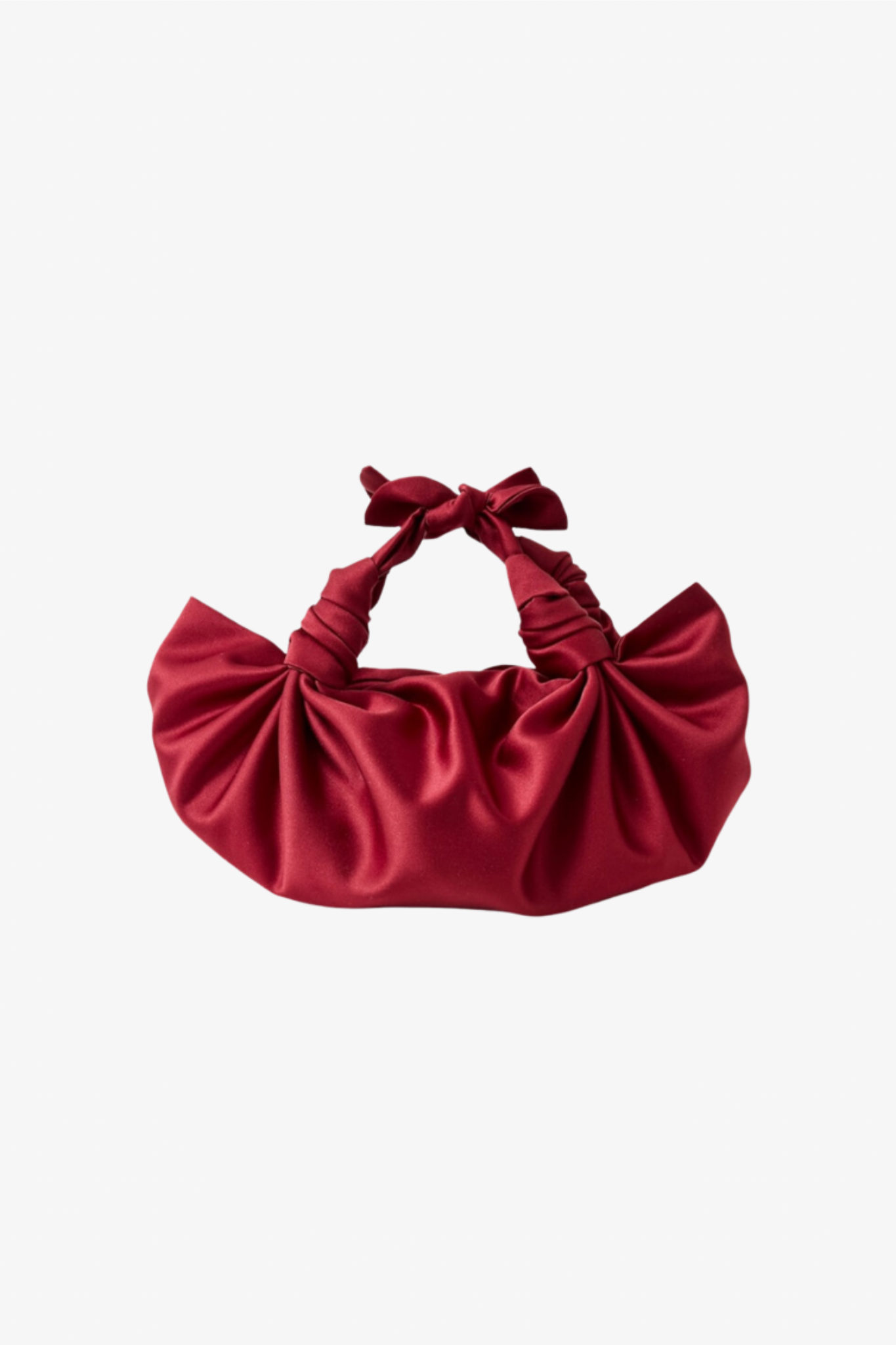 The merlot silk knot bag in a white background. Deadstock silky satin fabric sourced in Los Angeles.