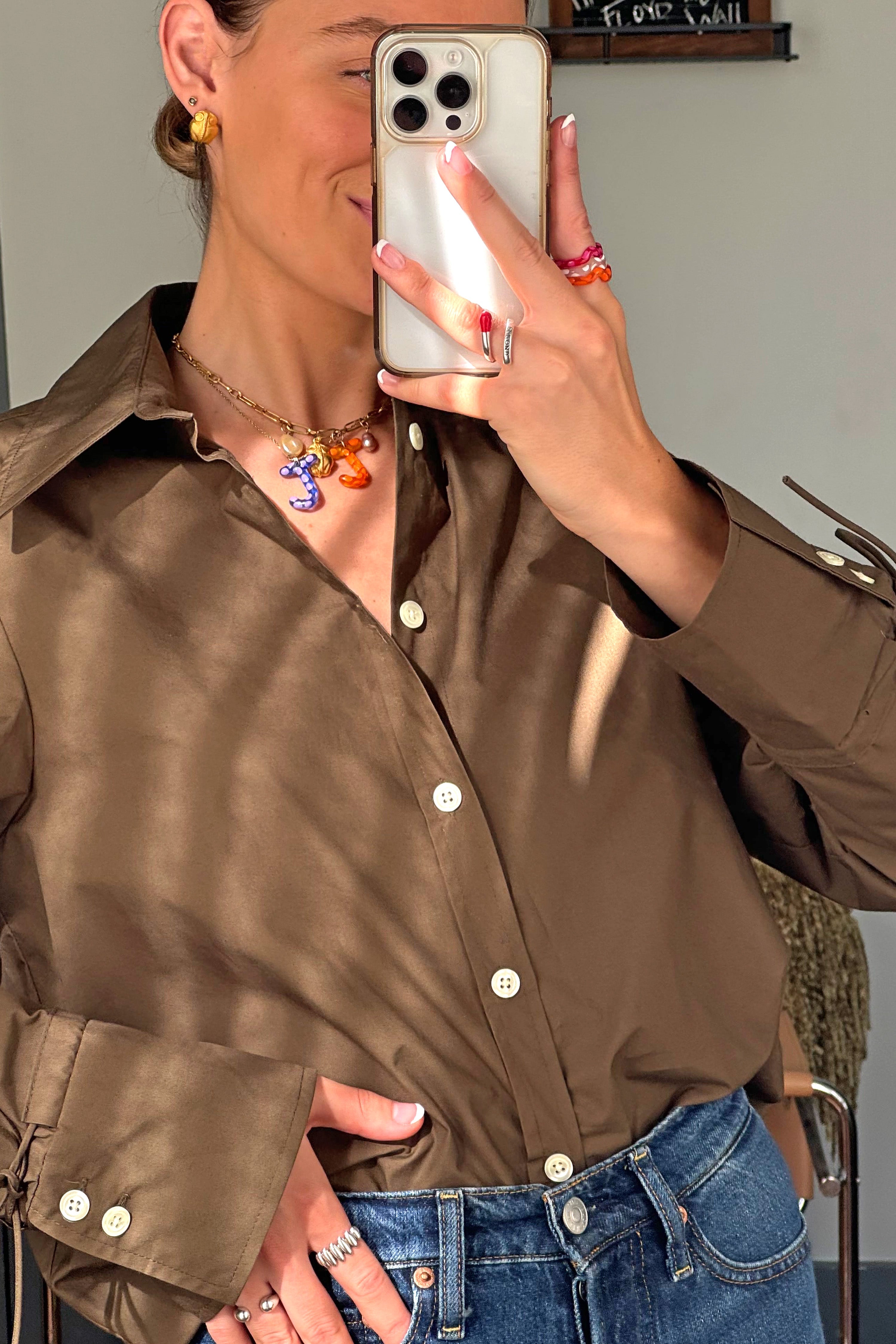 A hand model wearing the single wave raspberry ring. Charm are 3D printed and hand finished. Made in New York. 