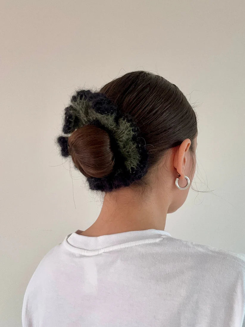 A model wearing the veronica scrunchie in a white background. Handmade in London!